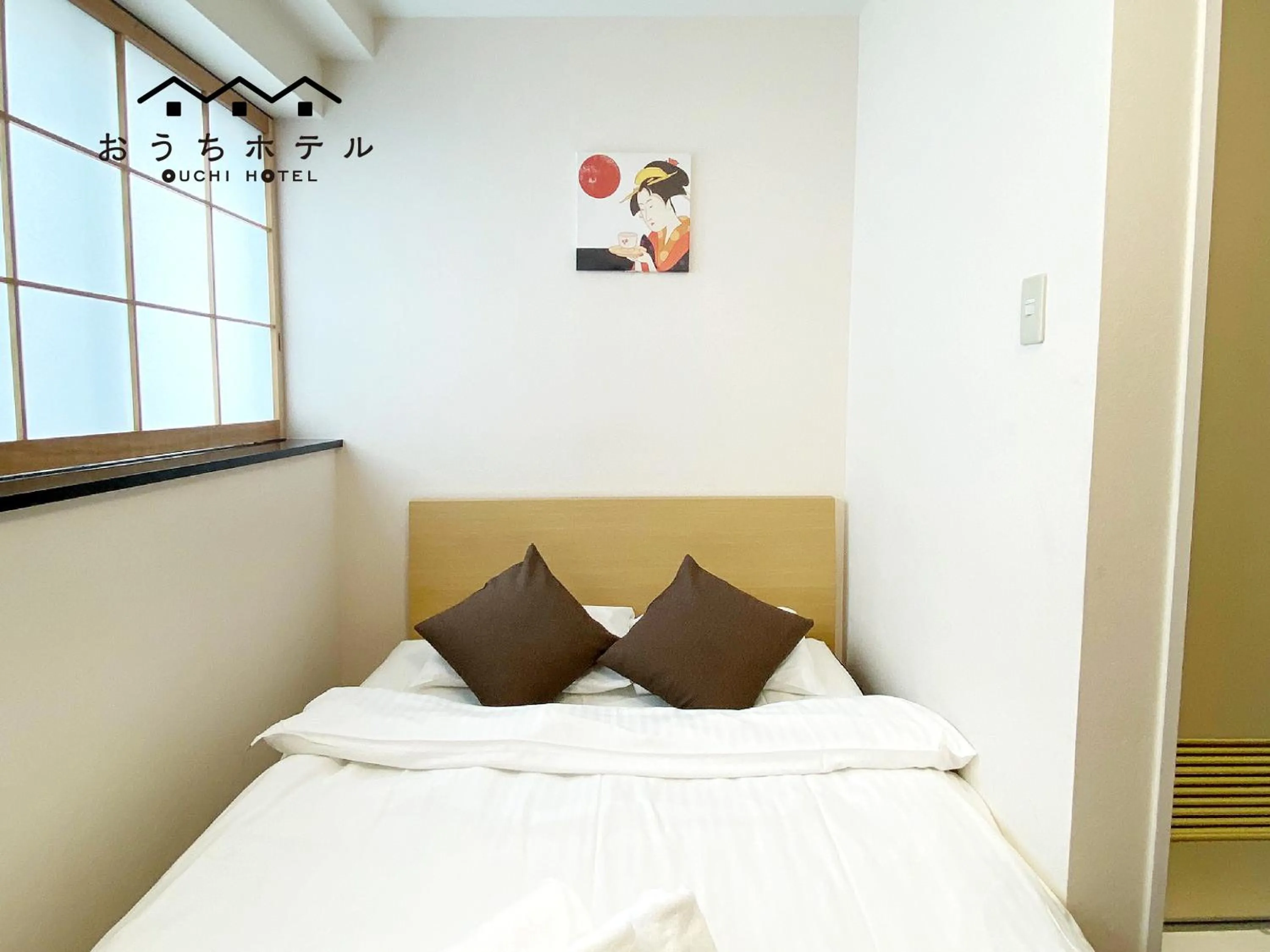 Bed in OUCHI HOTEL Yokogawa