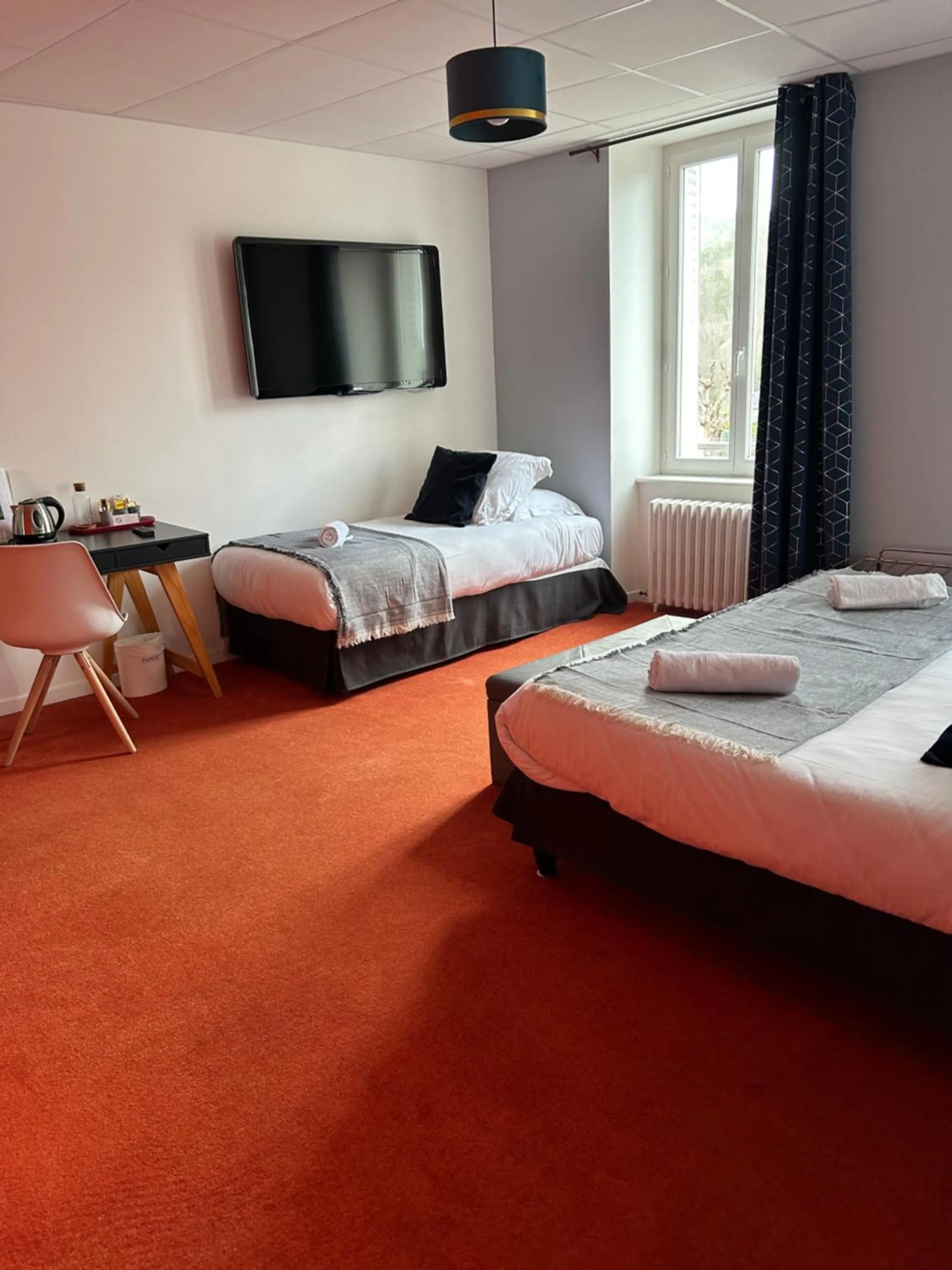 Bed in Logis Hôtel de Paris