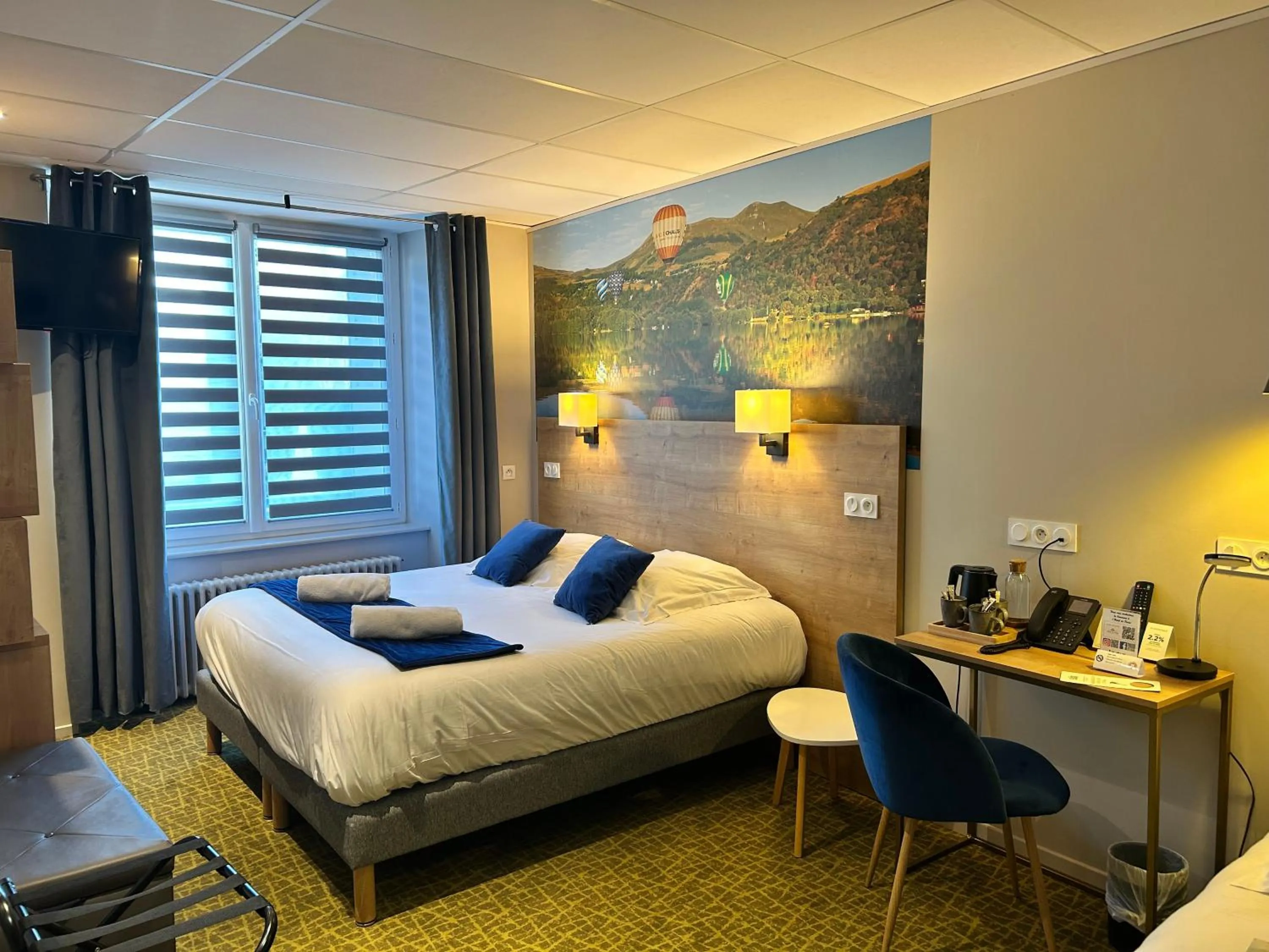 Bed in Logis Hôtel de Paris