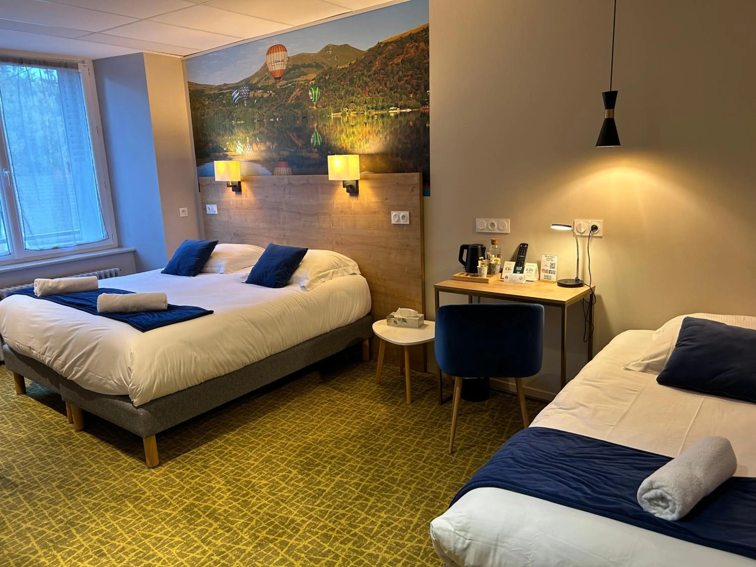 Bed in Logis Hôtel de Paris