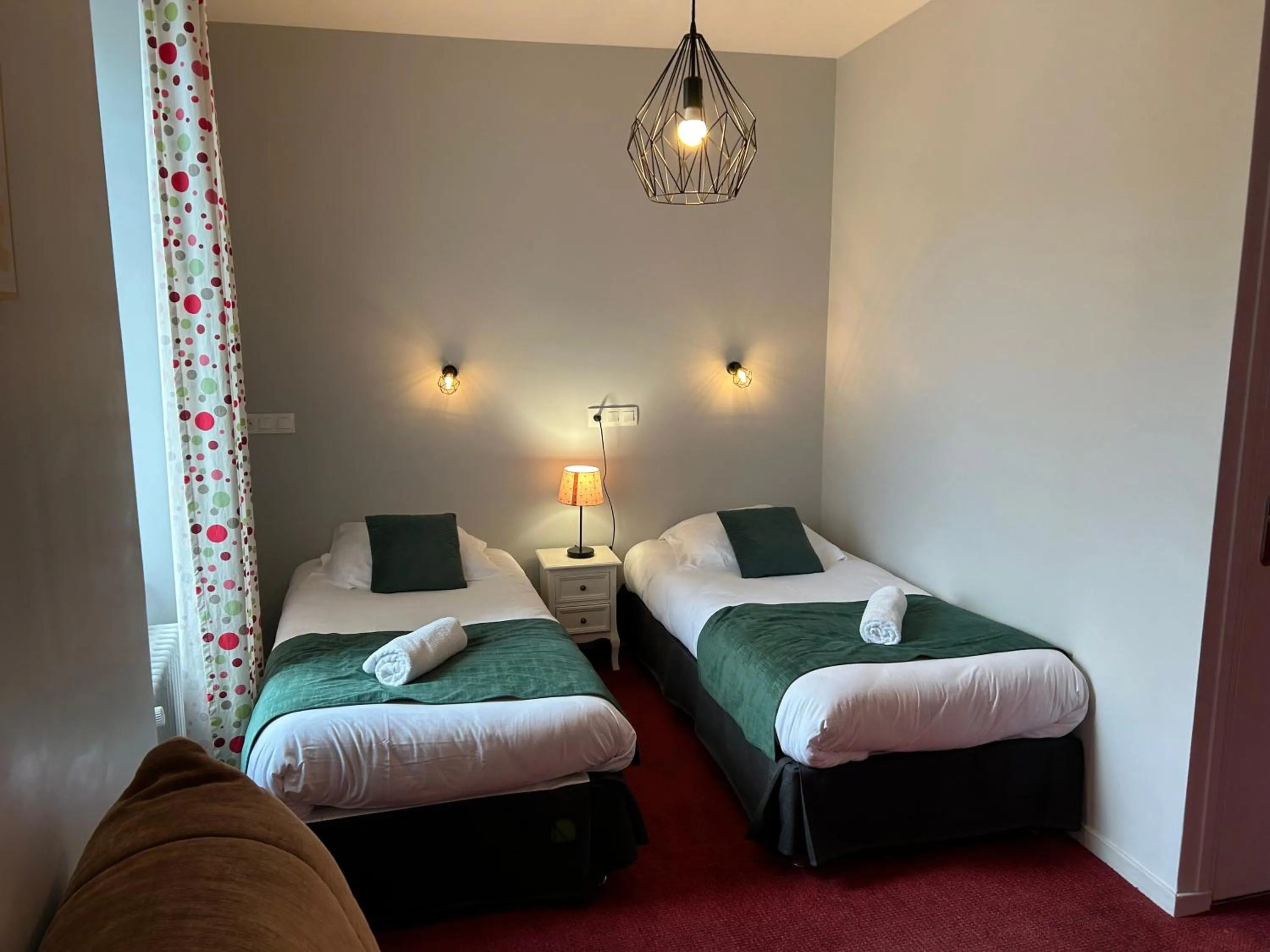 Bed in Logis Hôtel de Paris