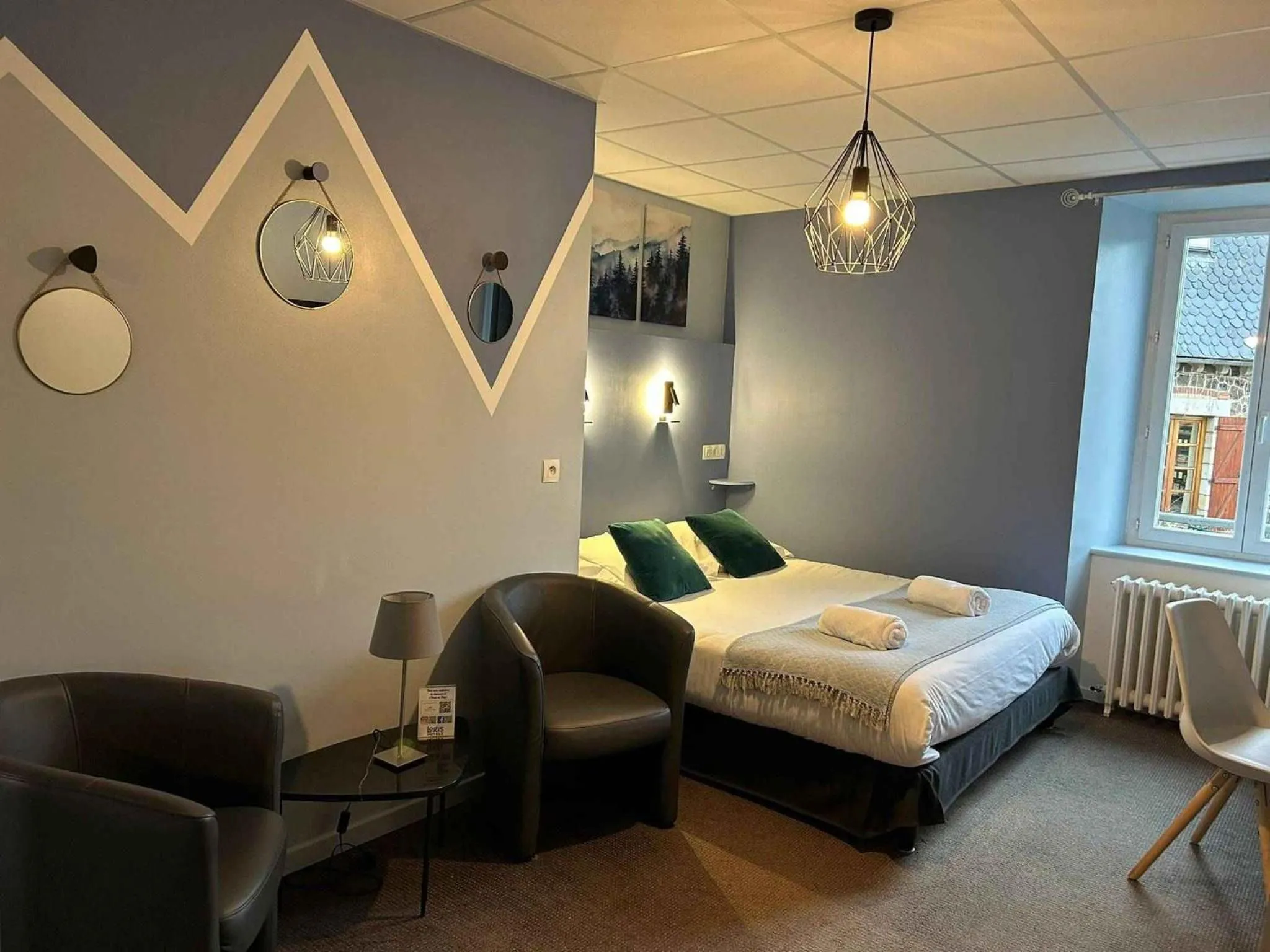 Bed in Logis Hôtel de Paris