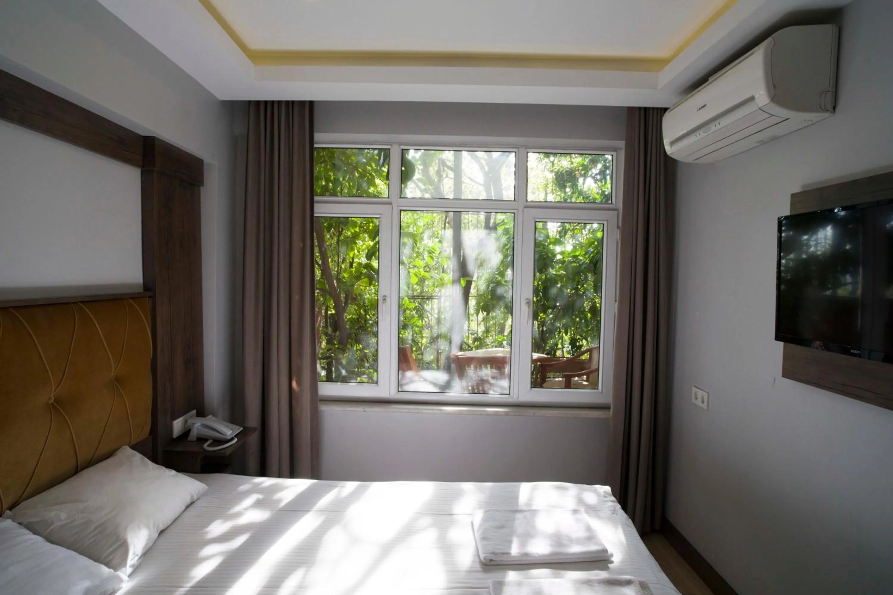 Photo of the whole room, Bed in Bucoleon by Cheers