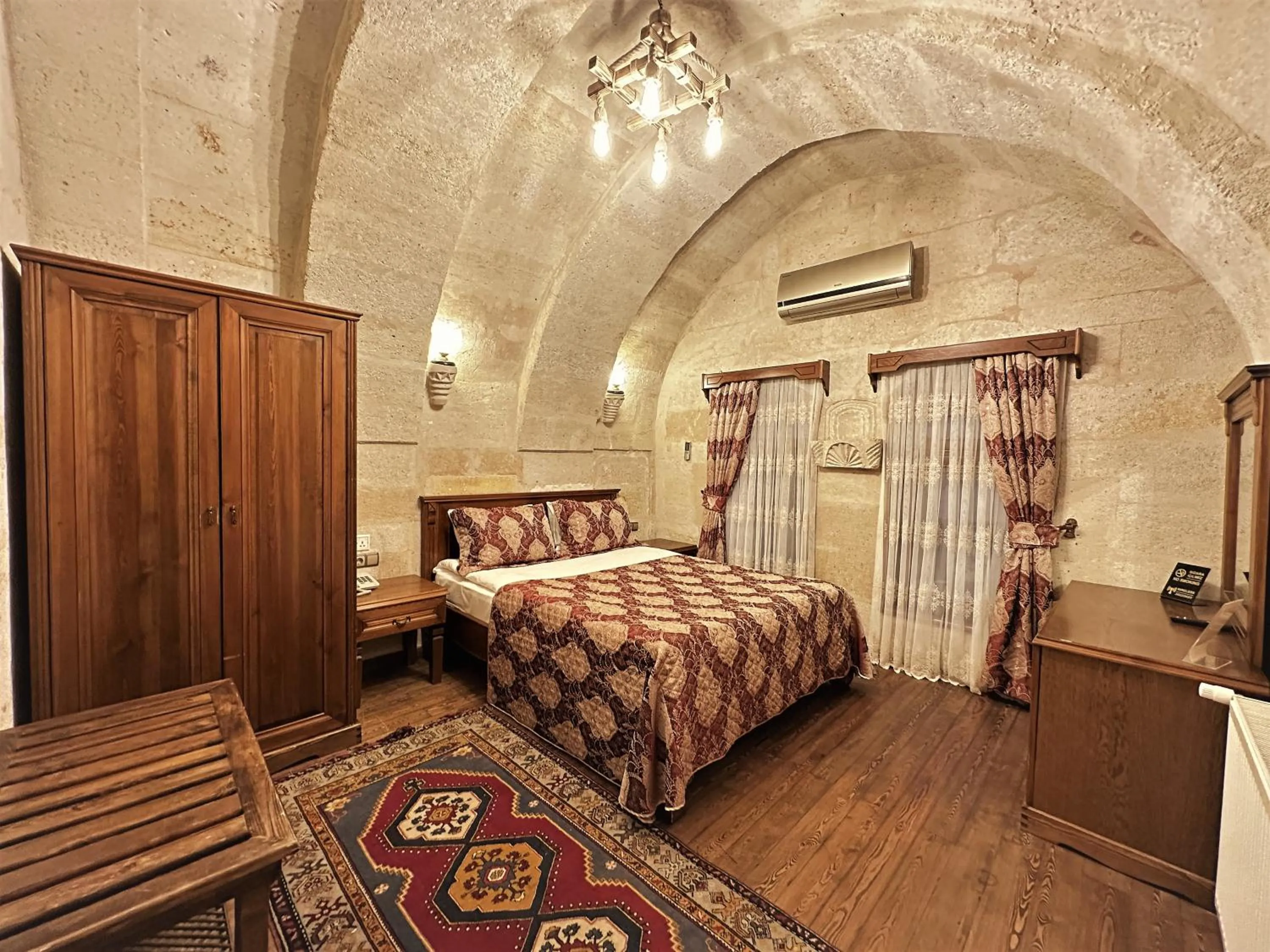 Bed in Stone House Cave Hotel