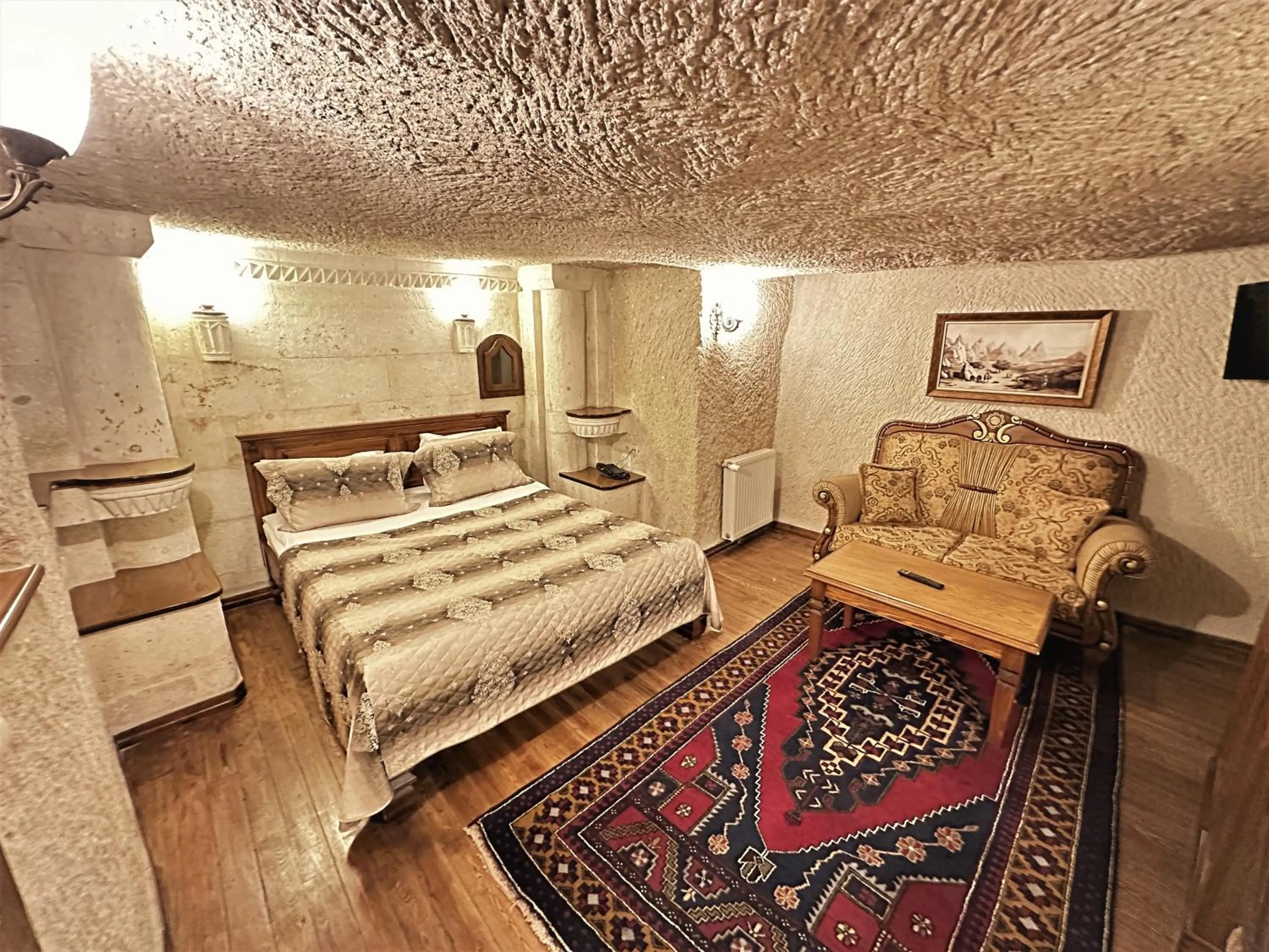 Bed in Stone House Cave Hotel