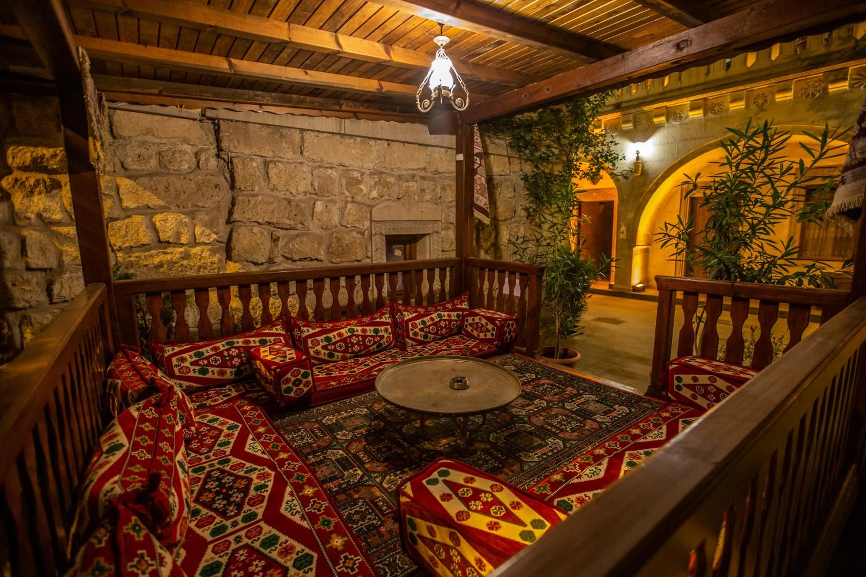 Seating area, Bed in Stone House Cave Hotel