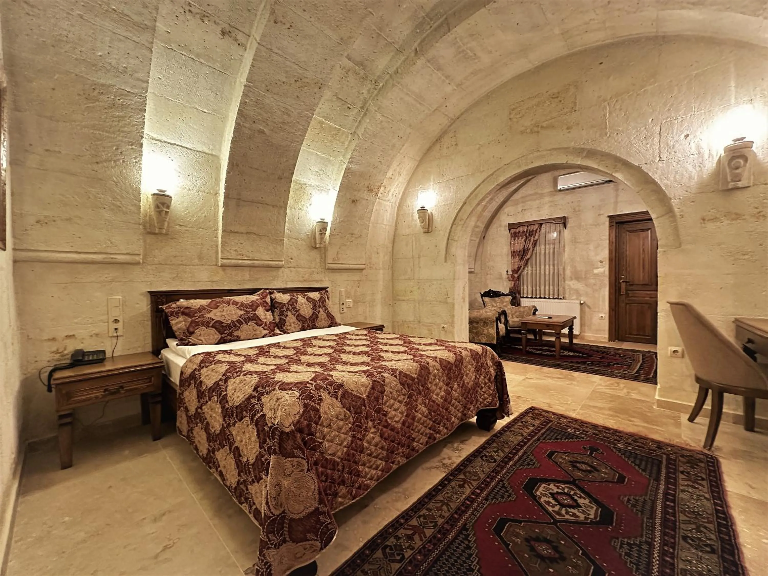 Bed in Stone House Cave Hotel