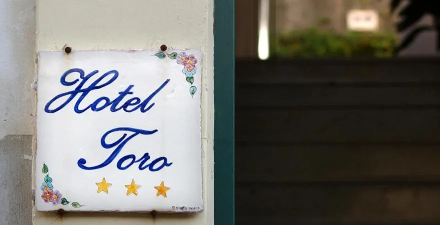 Property logo or sign in Hotel Toro