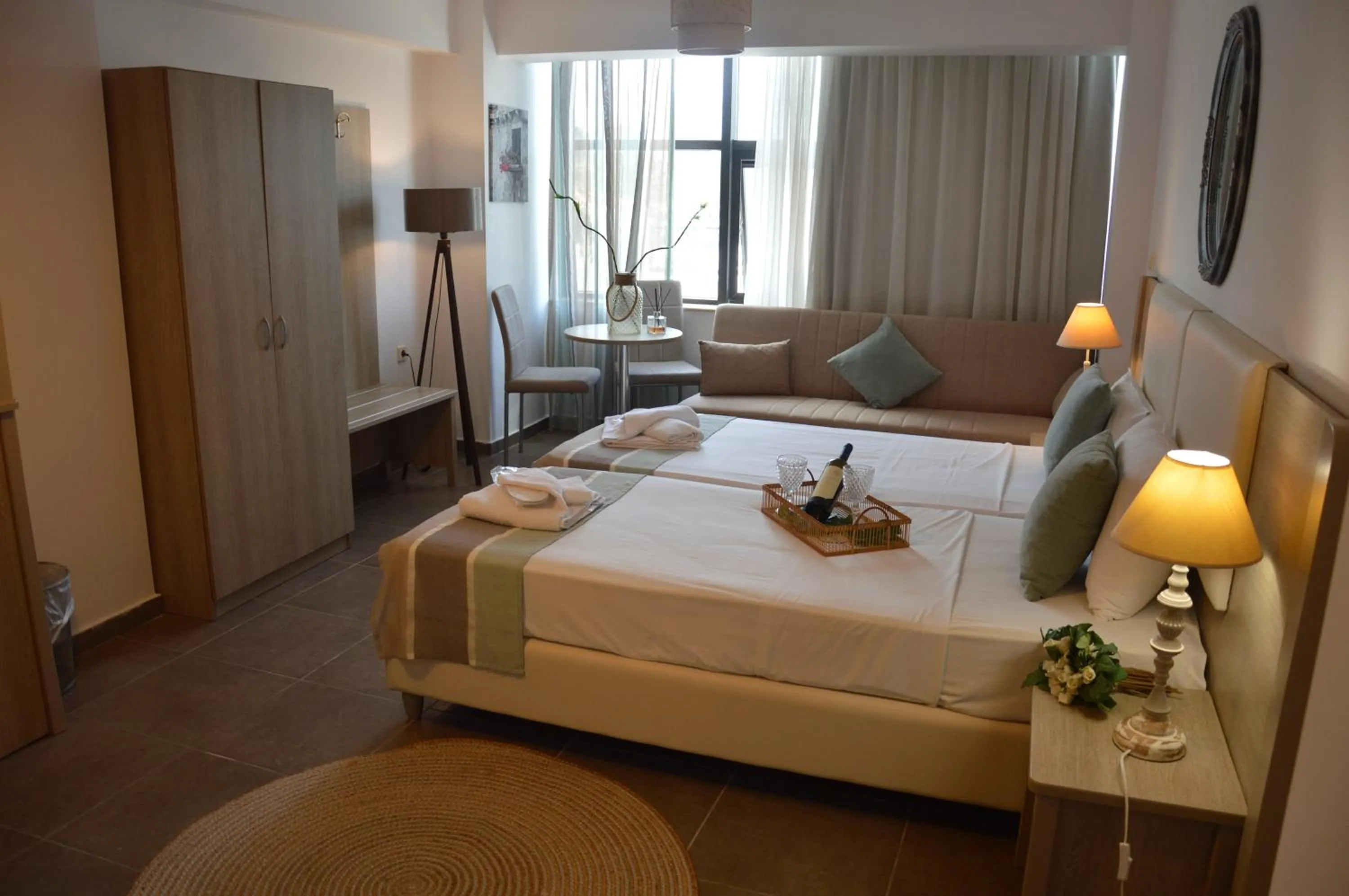 Bed in Aqua Mare Sea Side Rooms