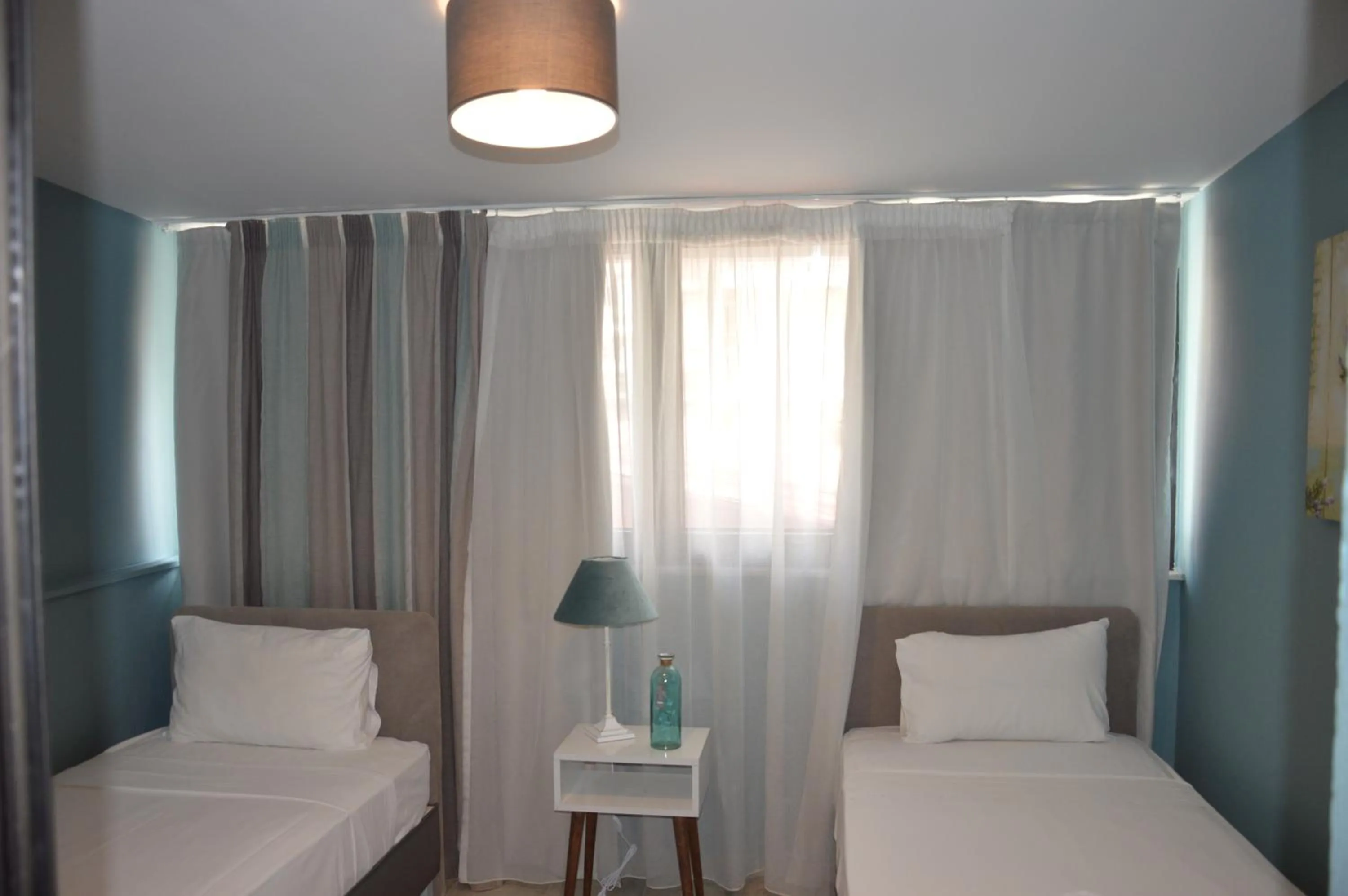 Bed in Aqua Mare Sea Side Rooms