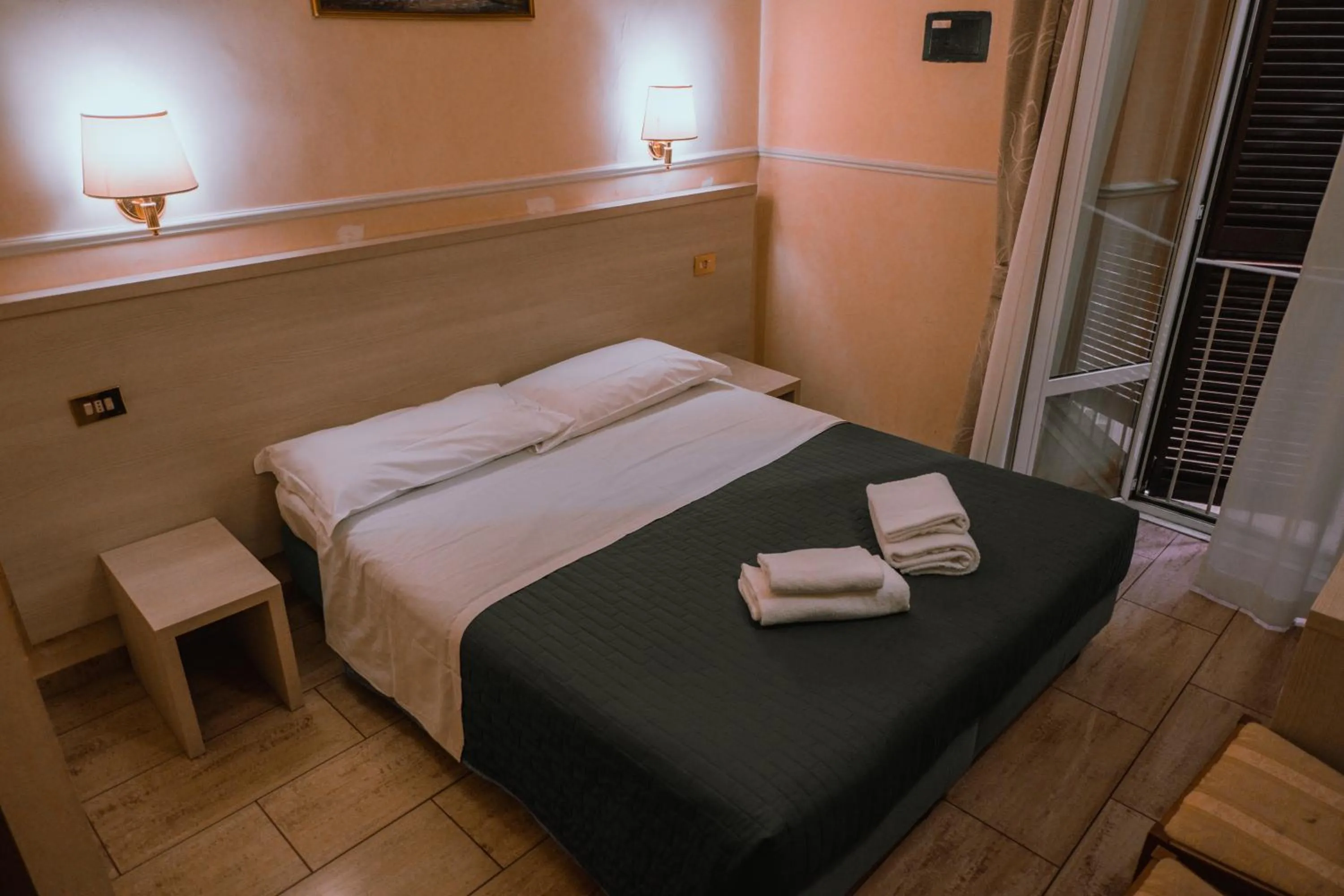 Bed in Hotel Aristotele