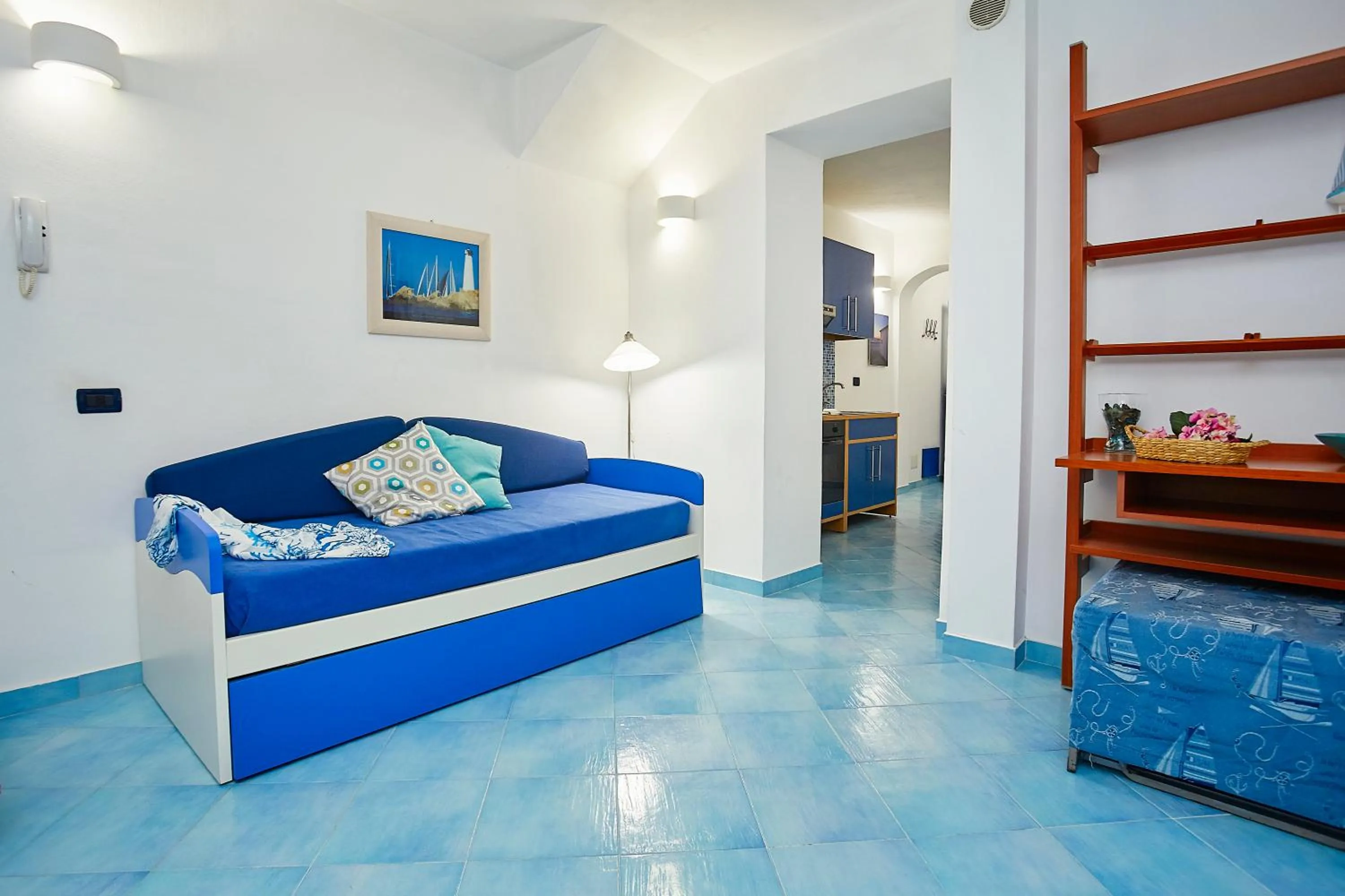 Living room, Bed in Appartamenti Rosa Dei Venti