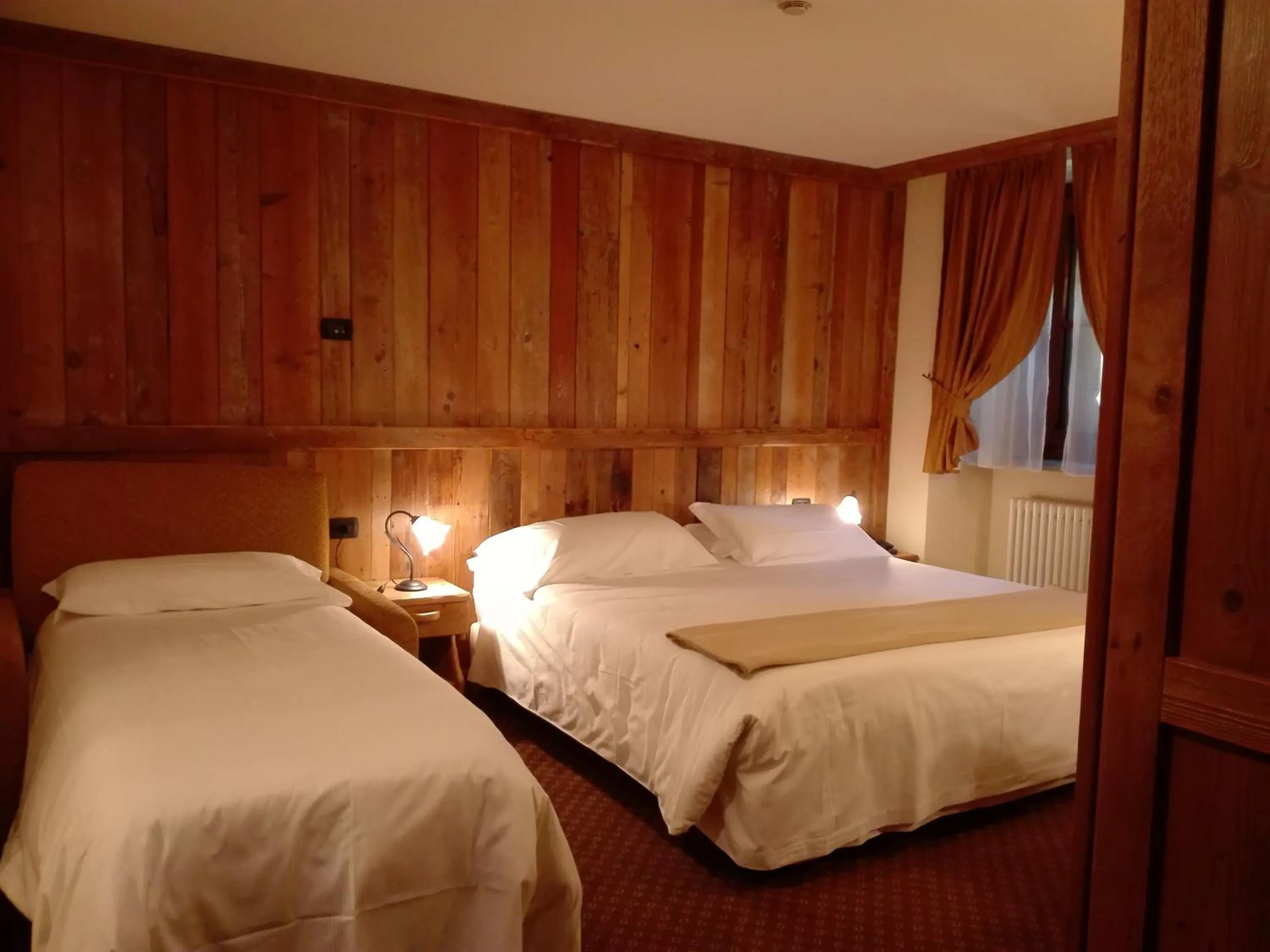 Bed in Le Miramonti Hotel Restaurant & Wellness