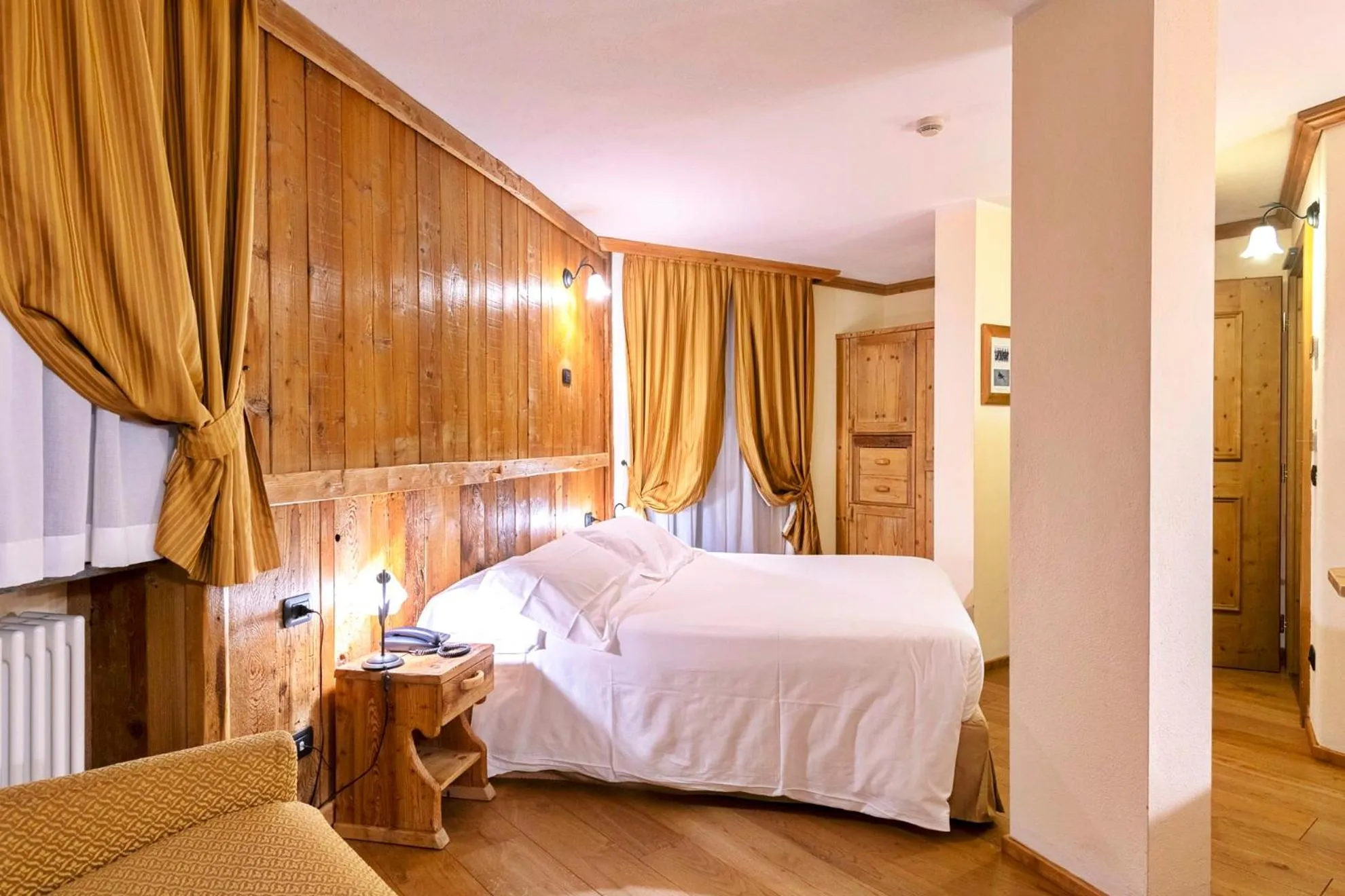 Bed in Le Miramonti Hotel Restaurant & Wellness