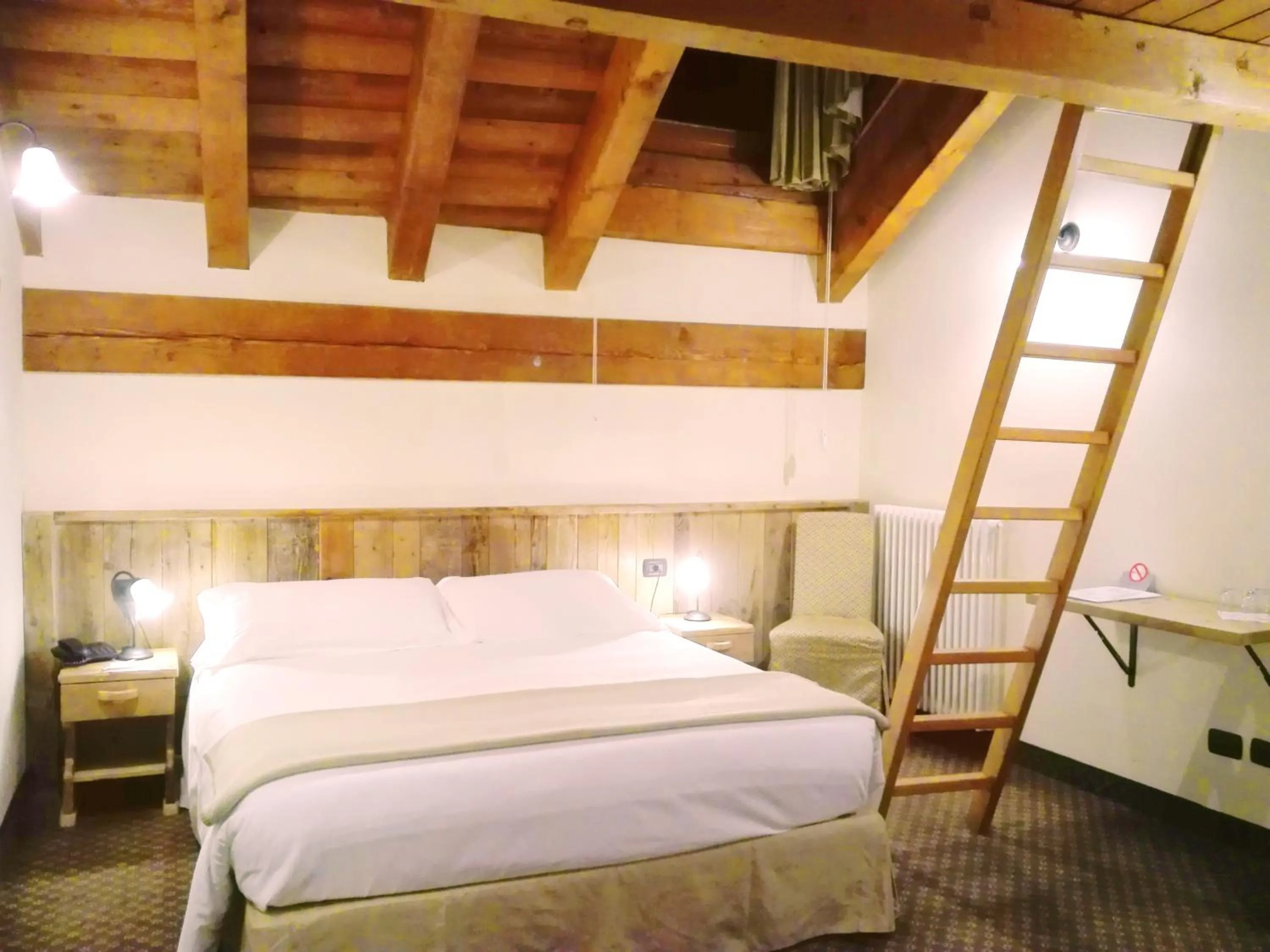 Bed in Le Miramonti Hotel Restaurant & Wellness