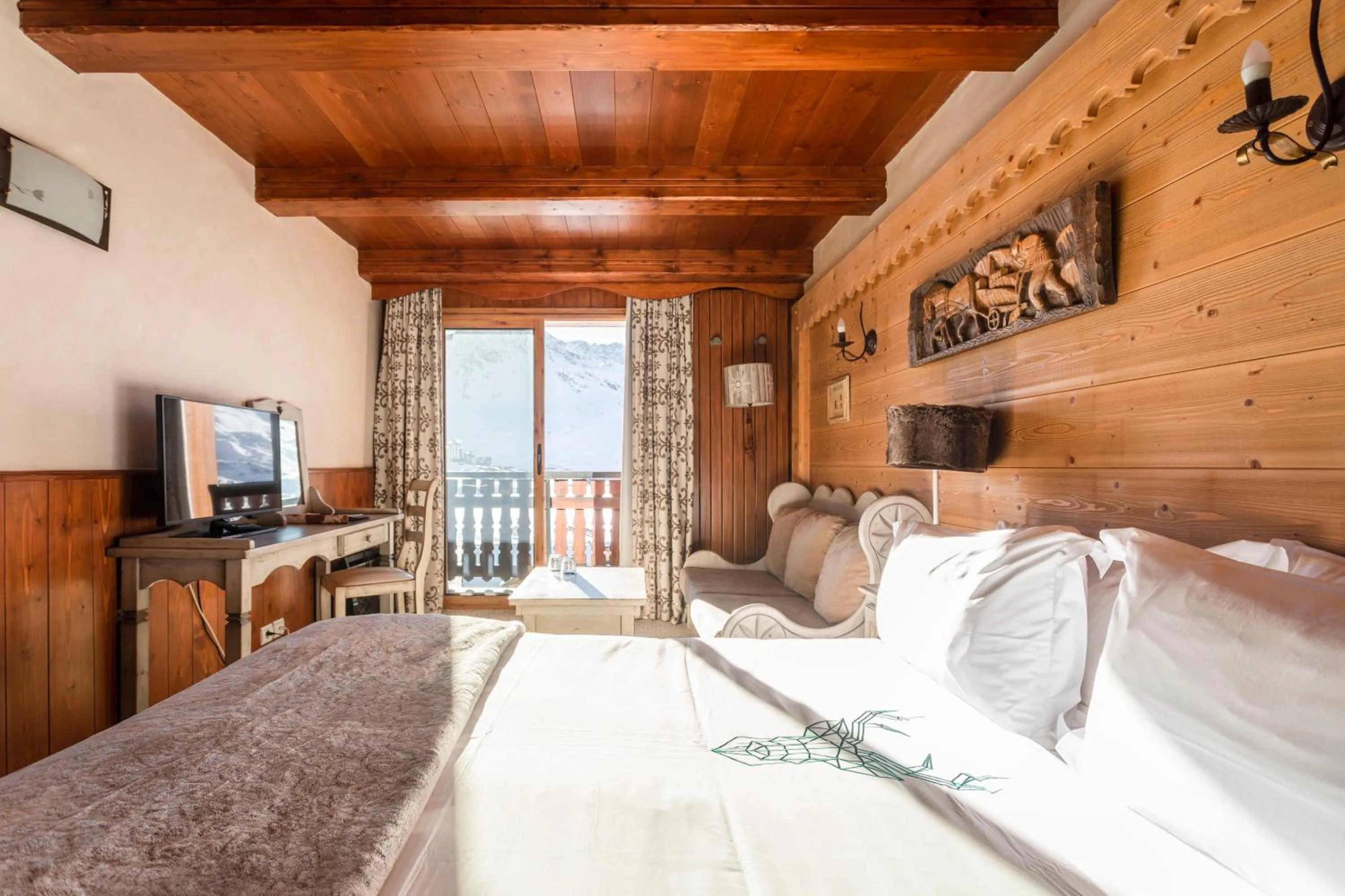 Bed in Hôtel les Campanules by Les Etincelles