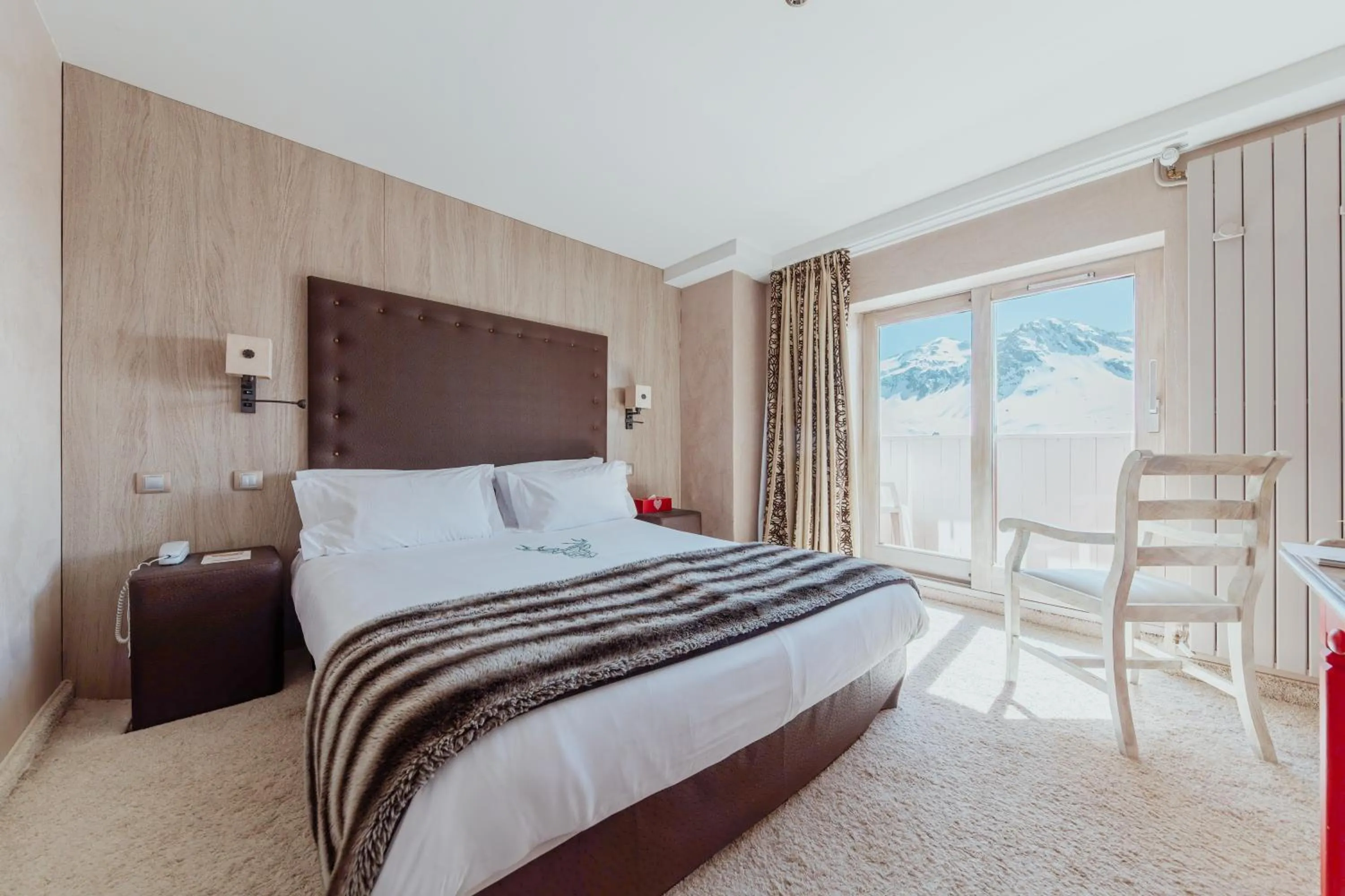 Bed in Hôtel les Campanules by Les Etincelles