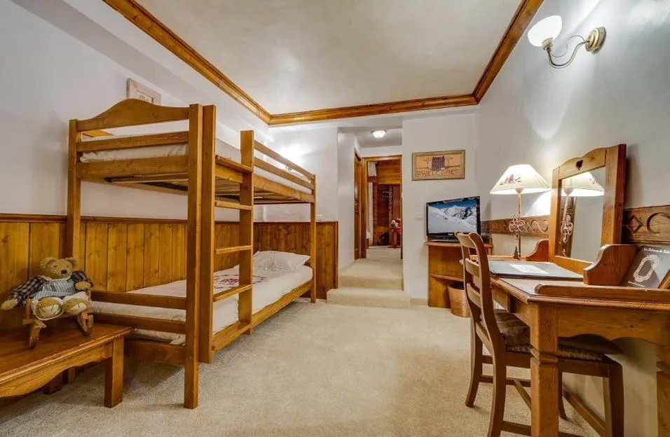 Bed in Hôtel les Campanules by Les Etincelles