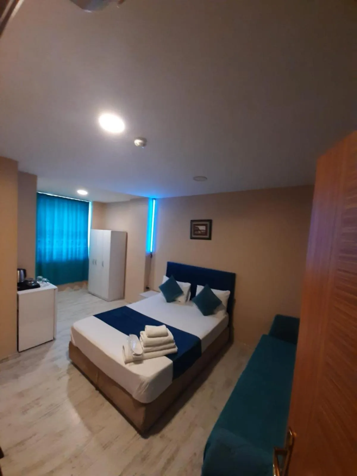 Photo of the whole room, Bed in 216 Turkuaz Suit