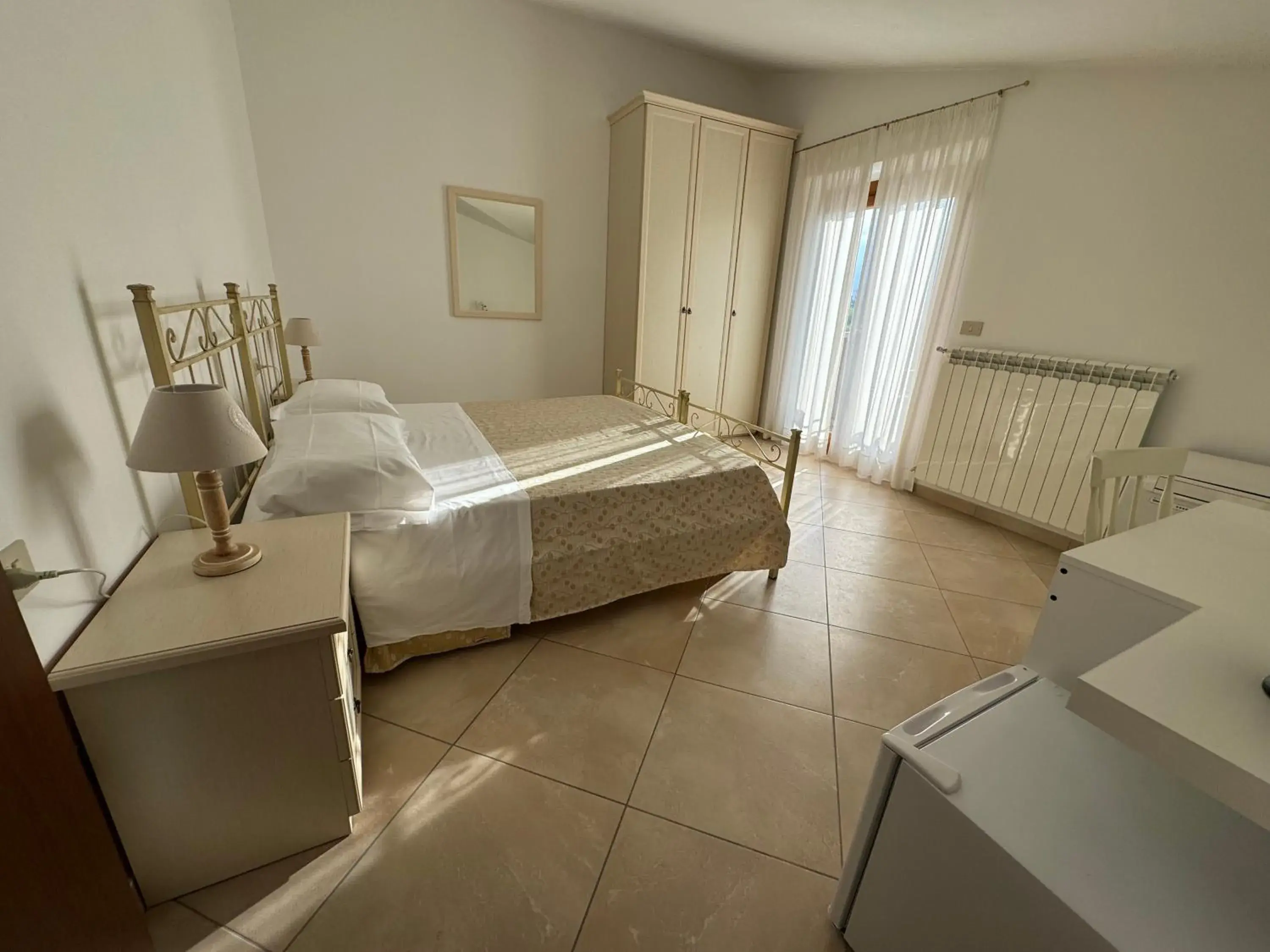 Quadruple Room with Balcony - single occupancy in Villa Emilia Quadruple Room with Balcony - single occupancy in Villa Emilia