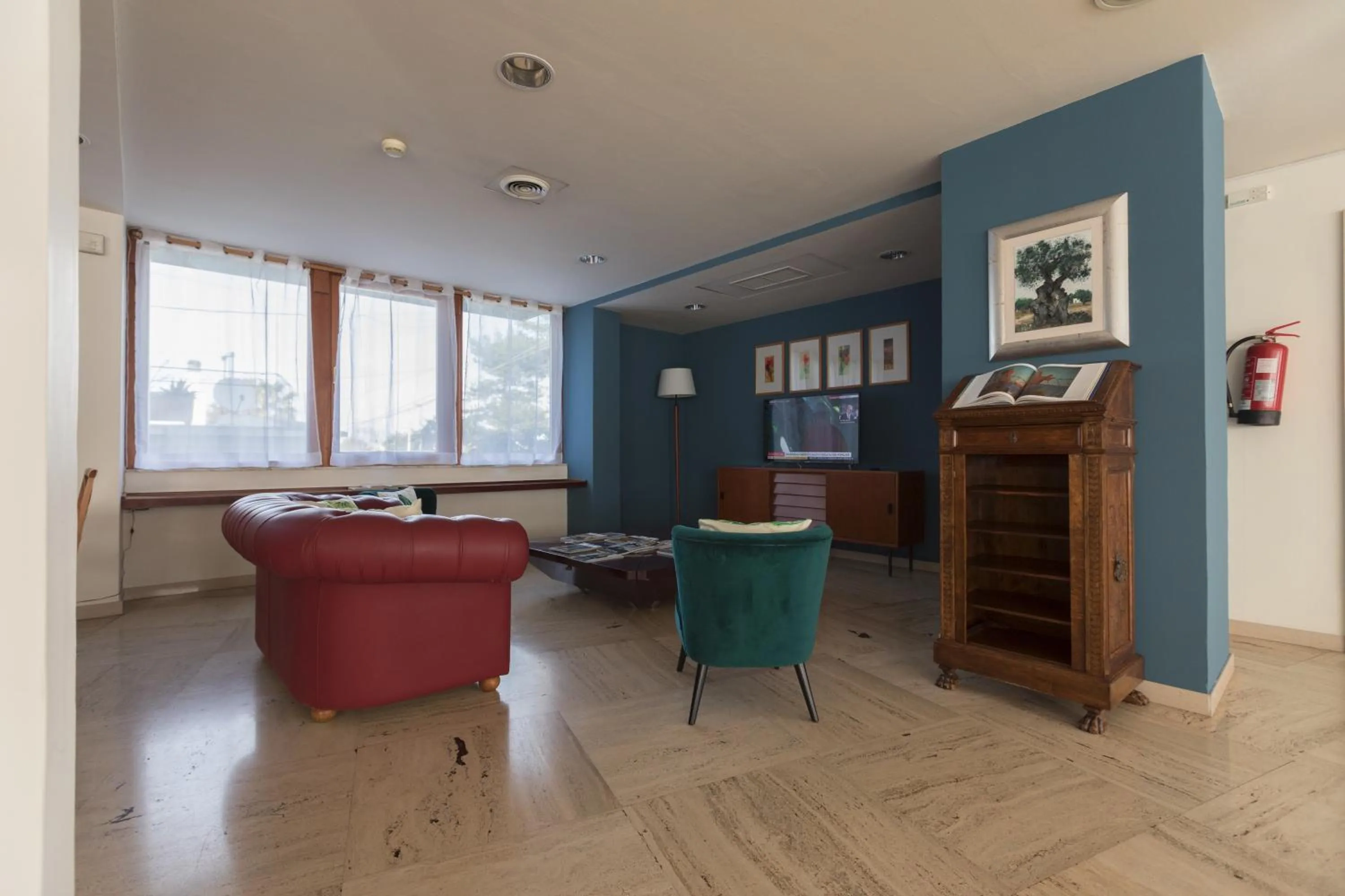 Communal lounge/ TV room in Hotel La Baia