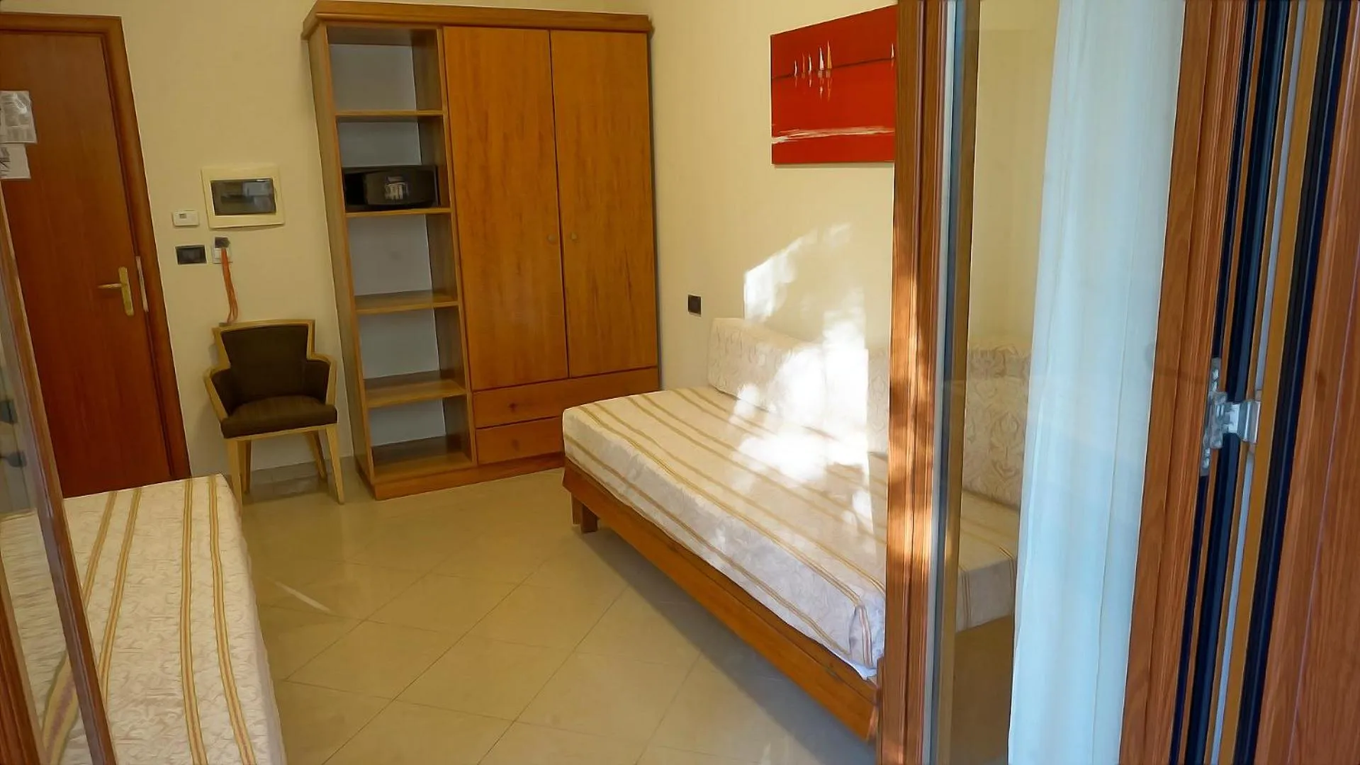 Communal lounge/ TV room, Bed in Hotel Residence Piccolo