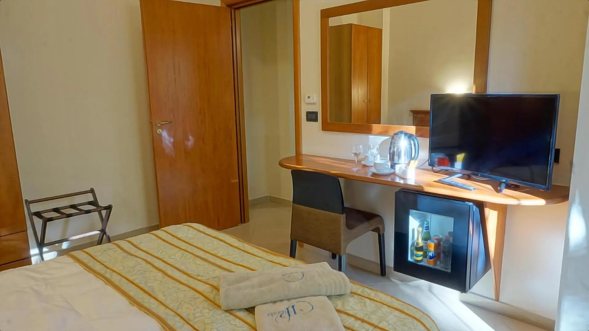 Communal lounge/ TV room, Bed in Hotel Residence Piccolo