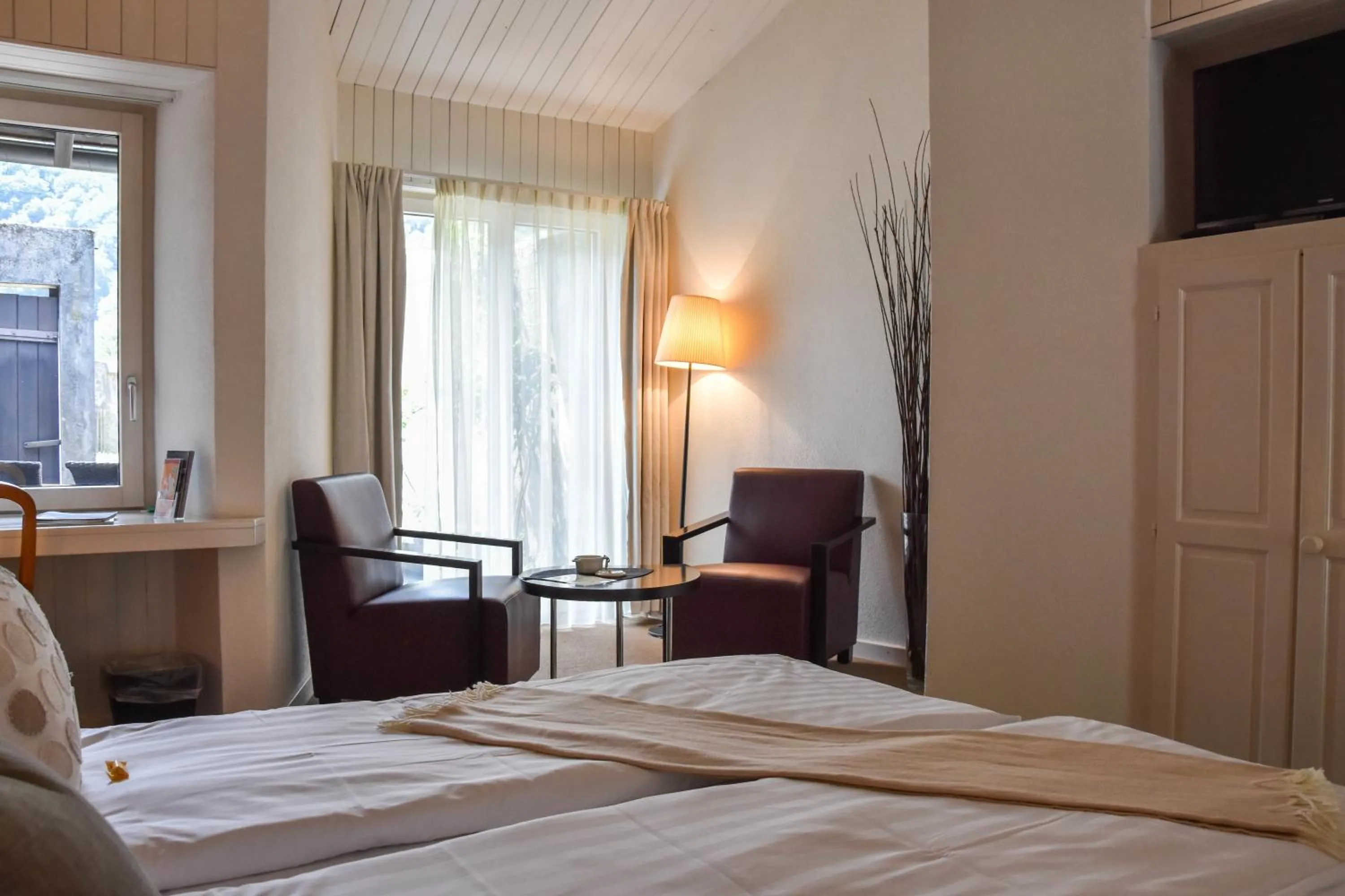 Seating area, Bed in Hôtel Restaurant Le Saint-Christophe