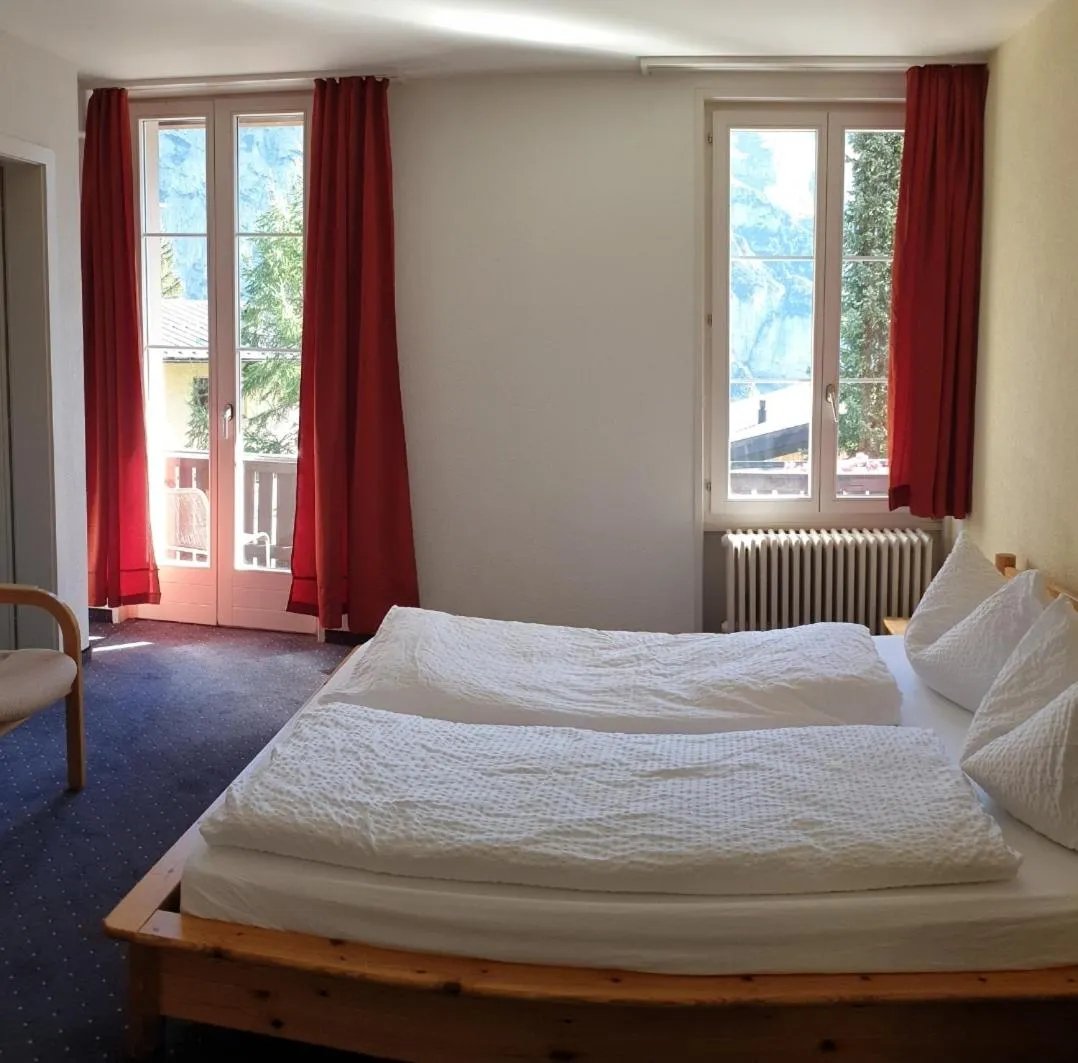Bed in Hotel Jungfrau Mürren