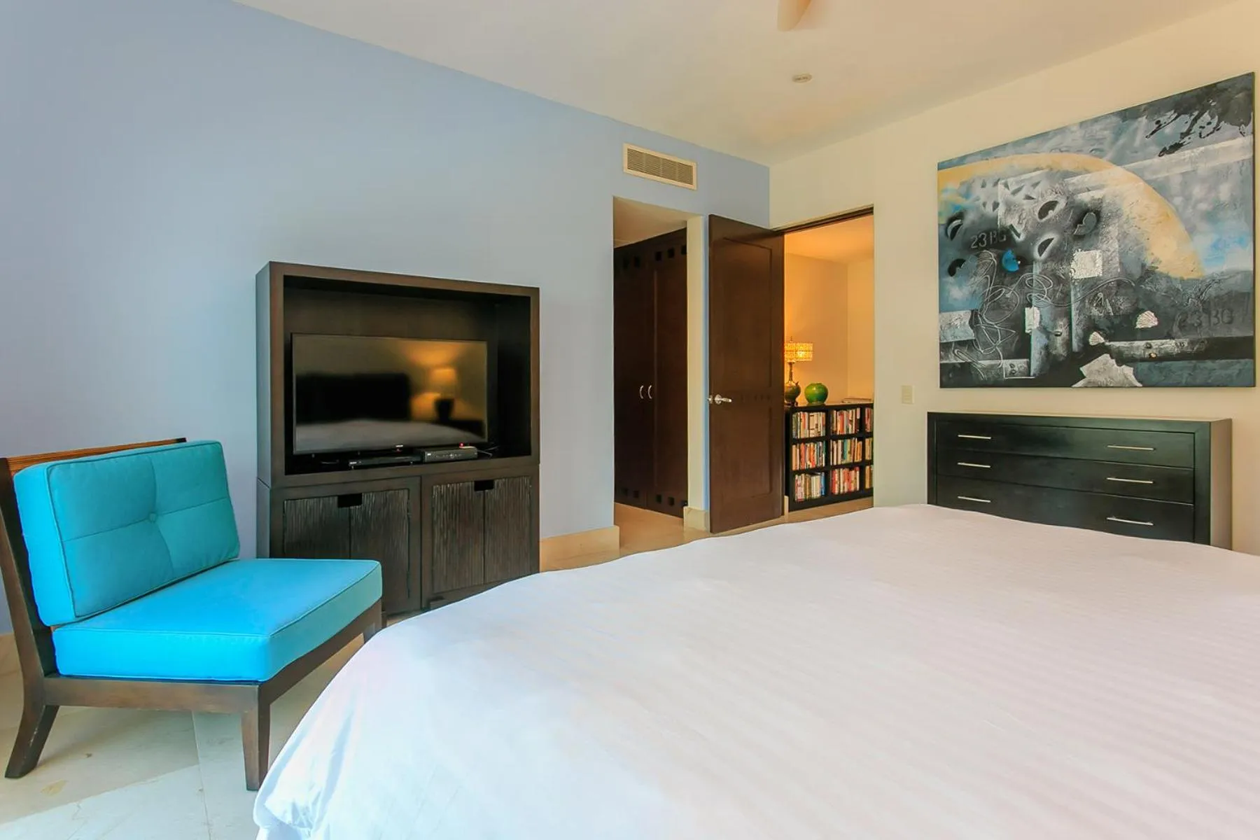 Bedroom in 3-Level Condo with a Private Balcony & Rooftop Lounge