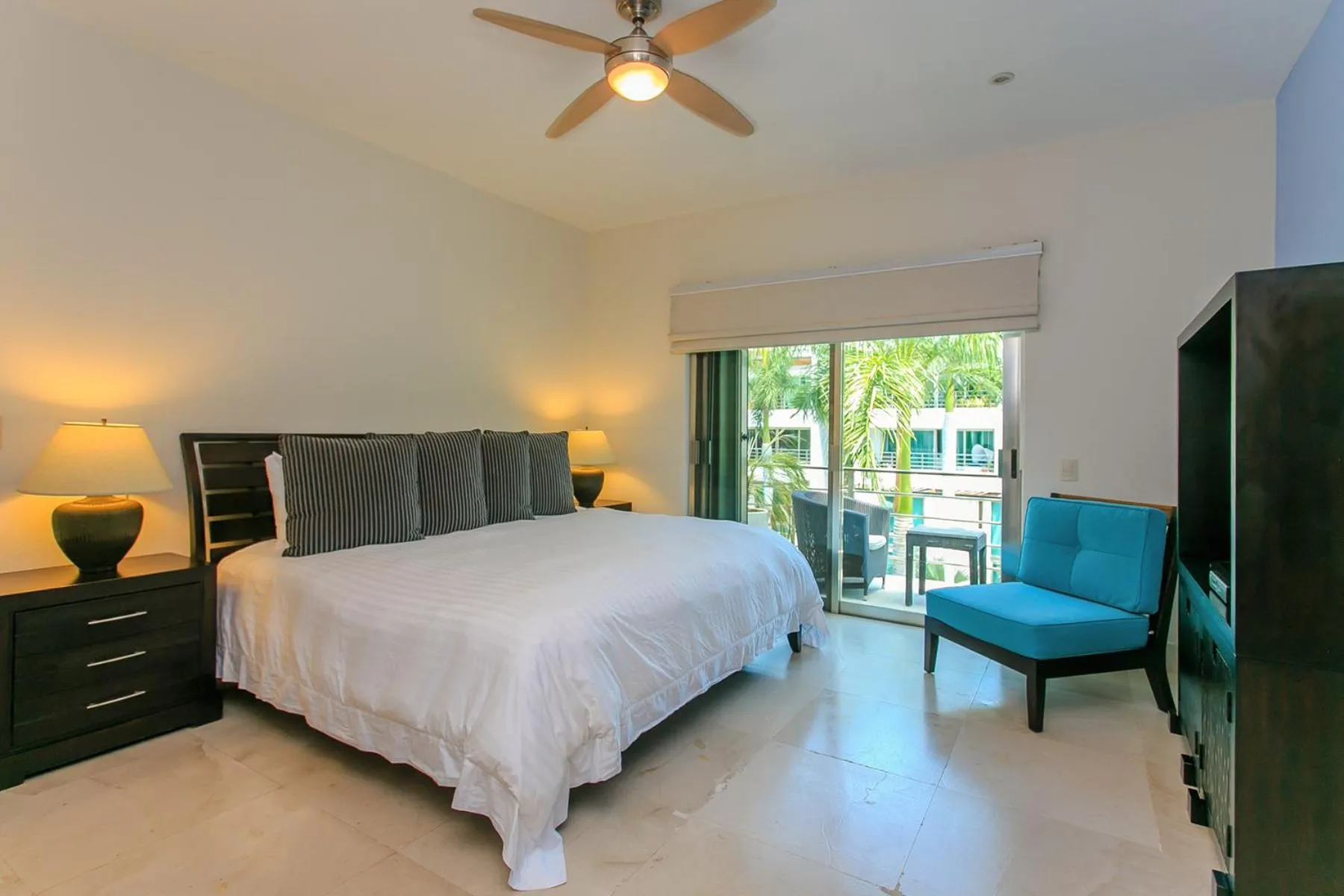 Bedroom in 3-Level Condo with a Private Balcony & Rooftop Lounge