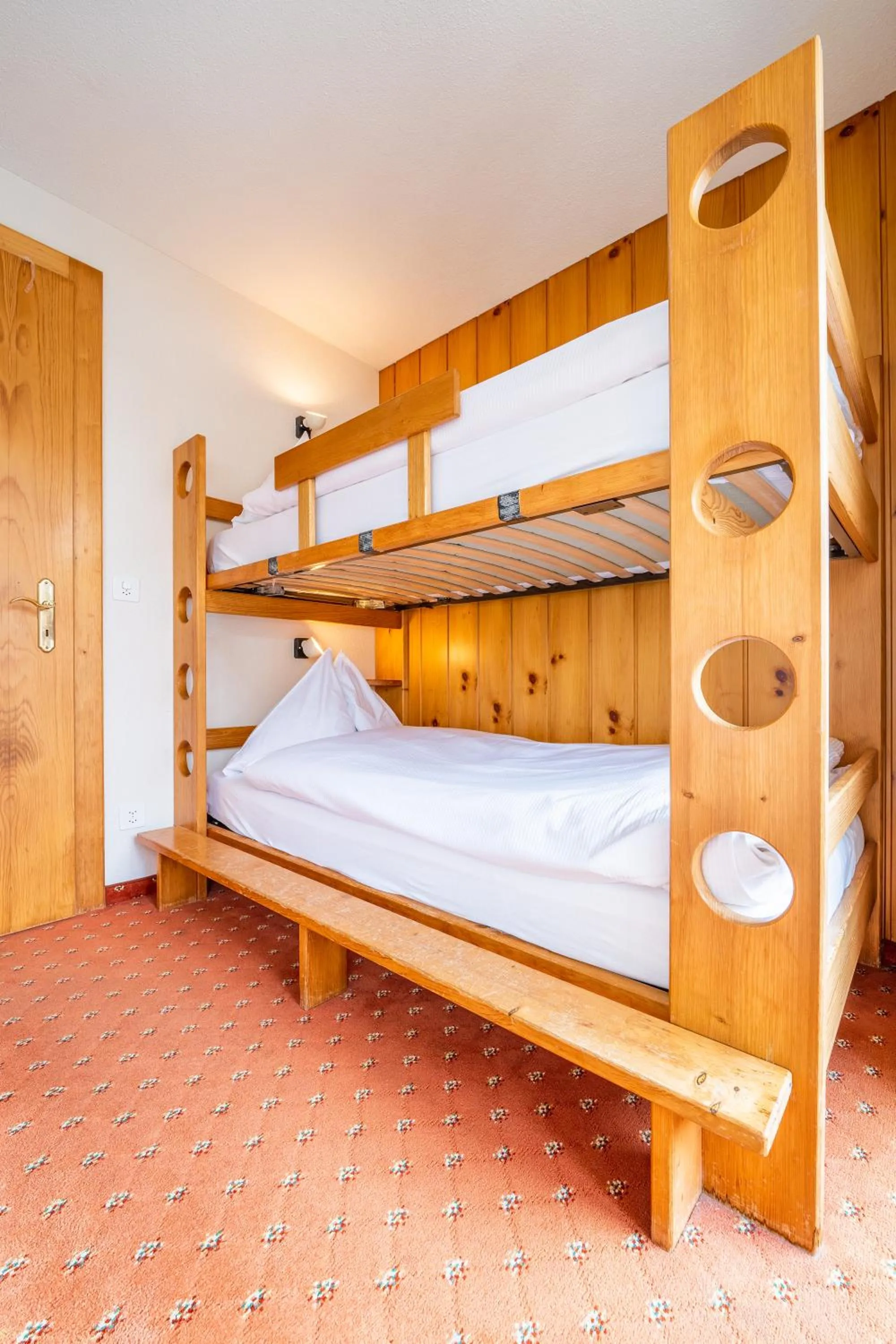 Bed in Hotel Christiania Saas-Fee