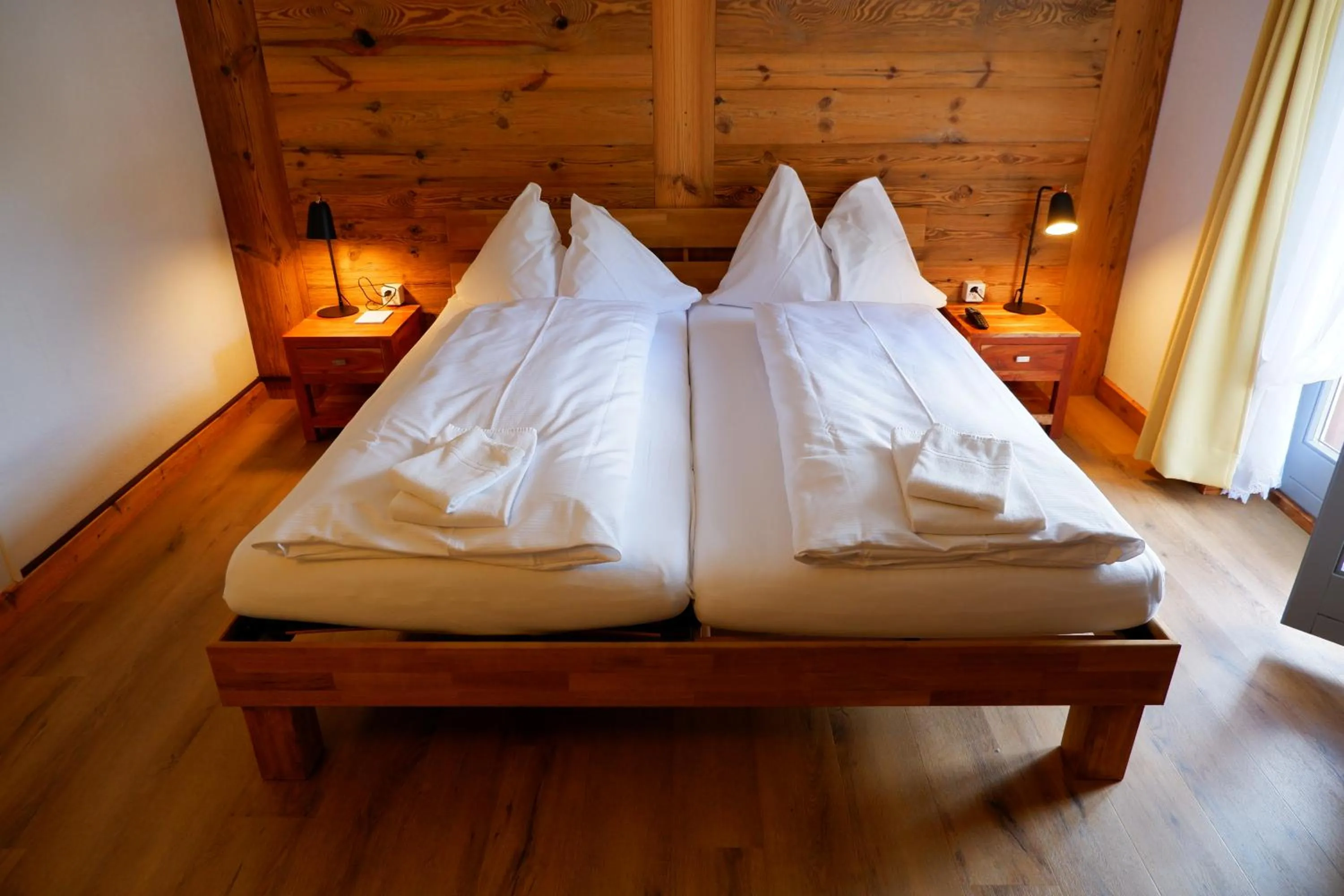 Bed in Hotel Christiania Saas-Fee