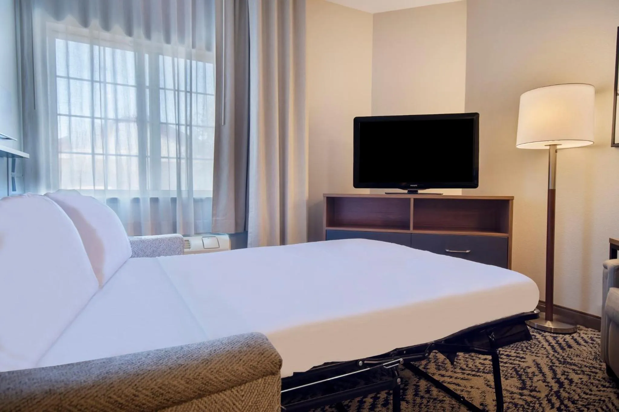 Photo of the whole room, Bed in Candlewood Suites Buffalo Amherst by IHG