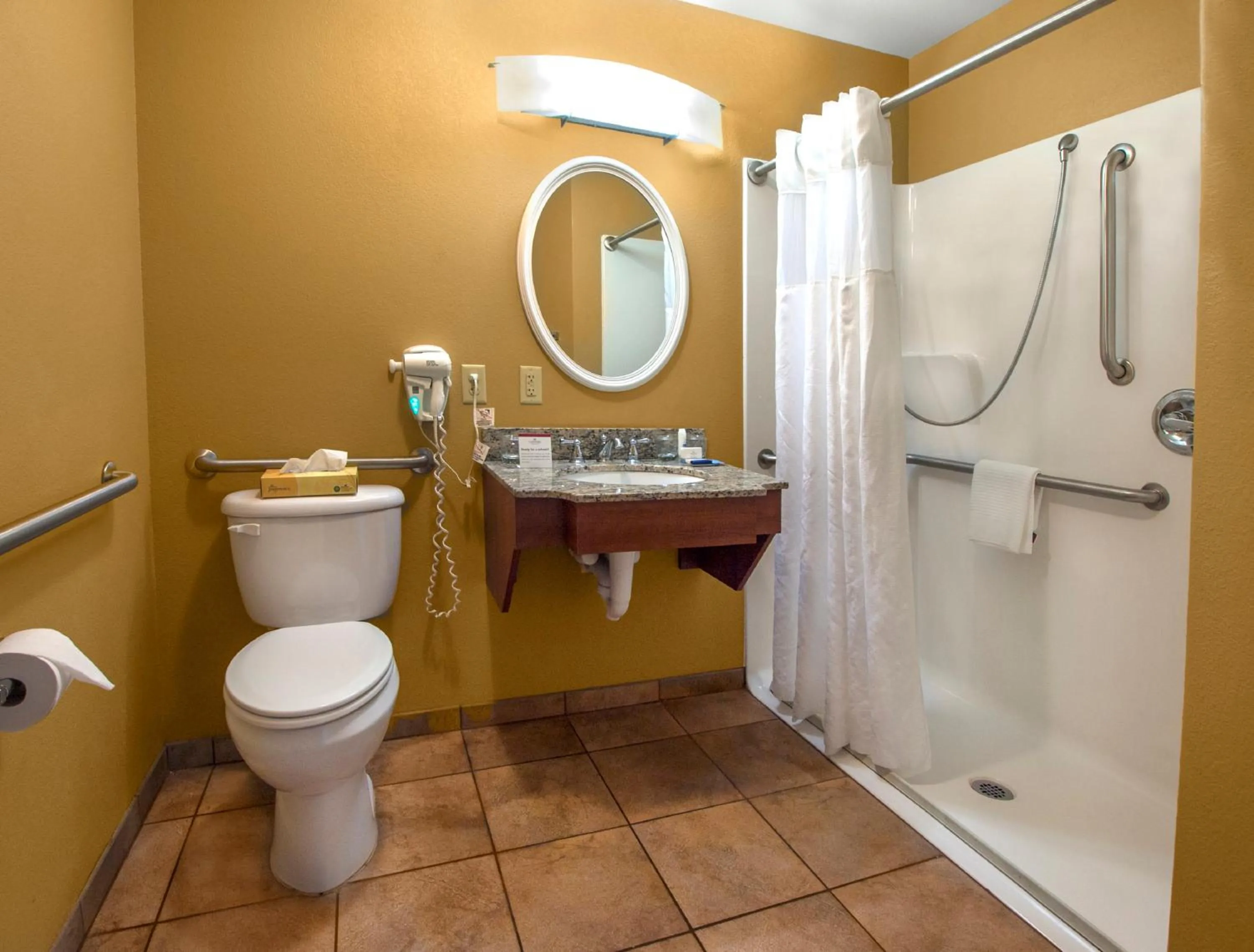 Bathroom in Candlewood Suites Buffalo Amherst by IHG