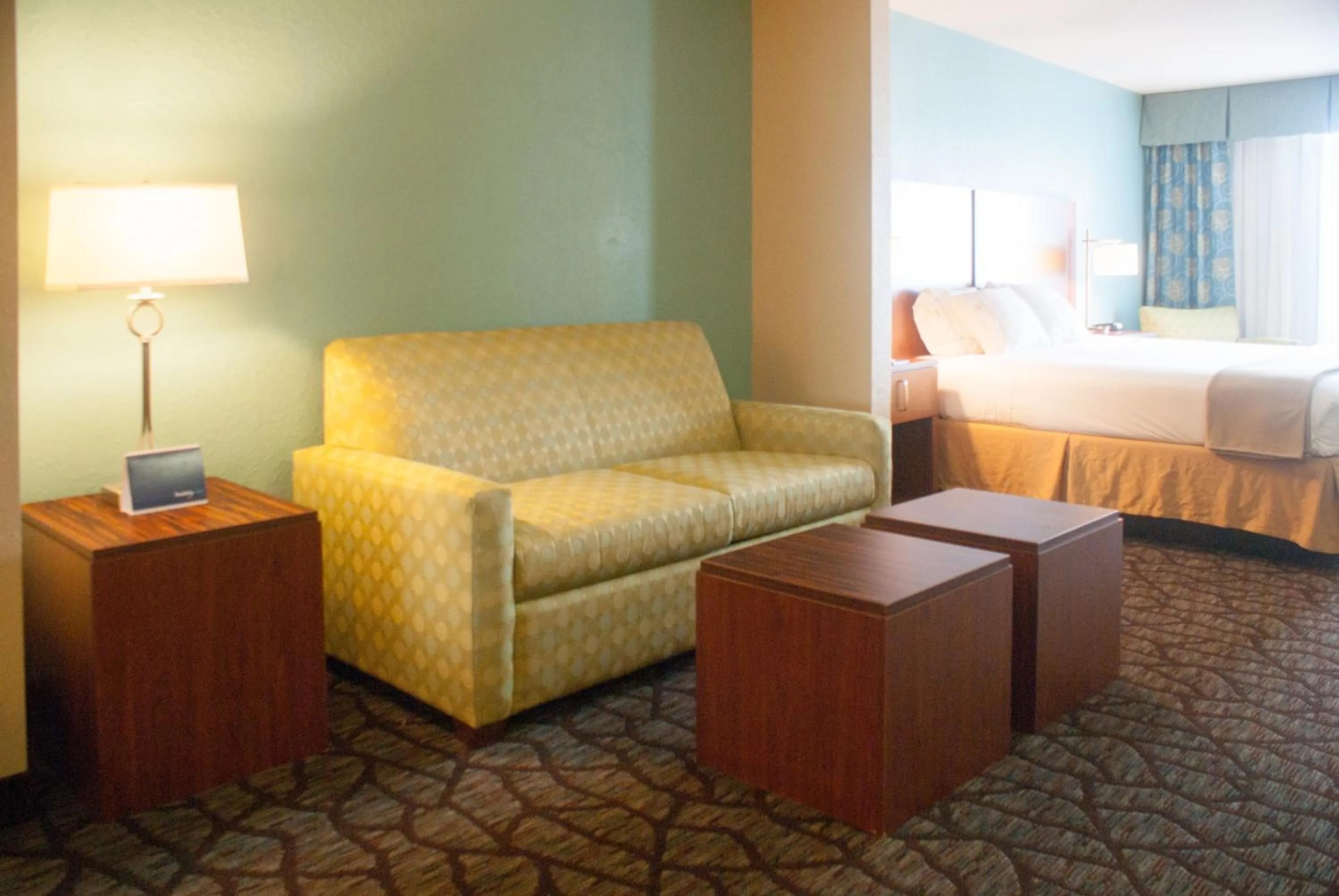 Living room, Bed in Holiday Inn Express & Suites Jacksonville South - I-295 by IHG