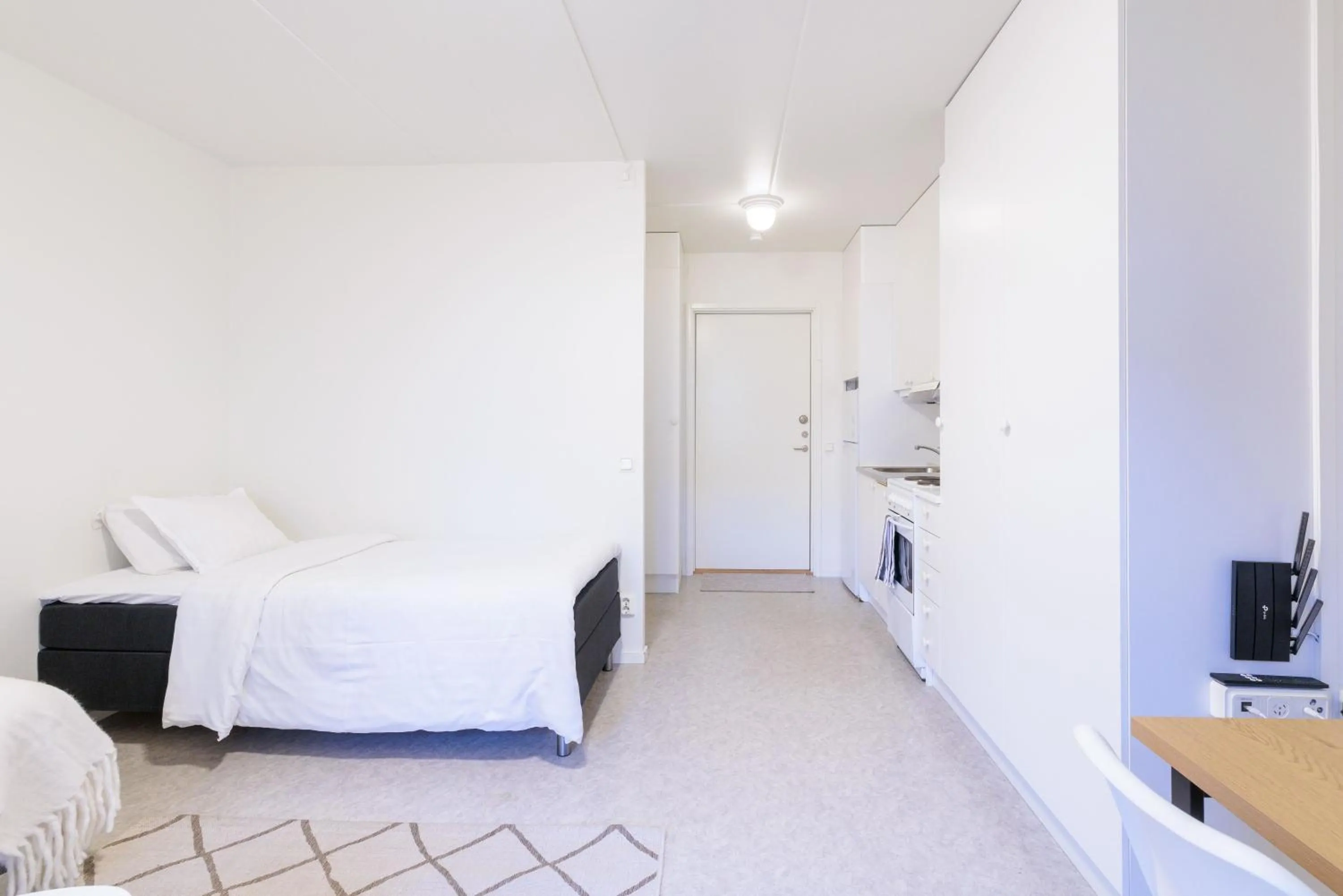 Bed in Easy Livin' Apartment Hotel