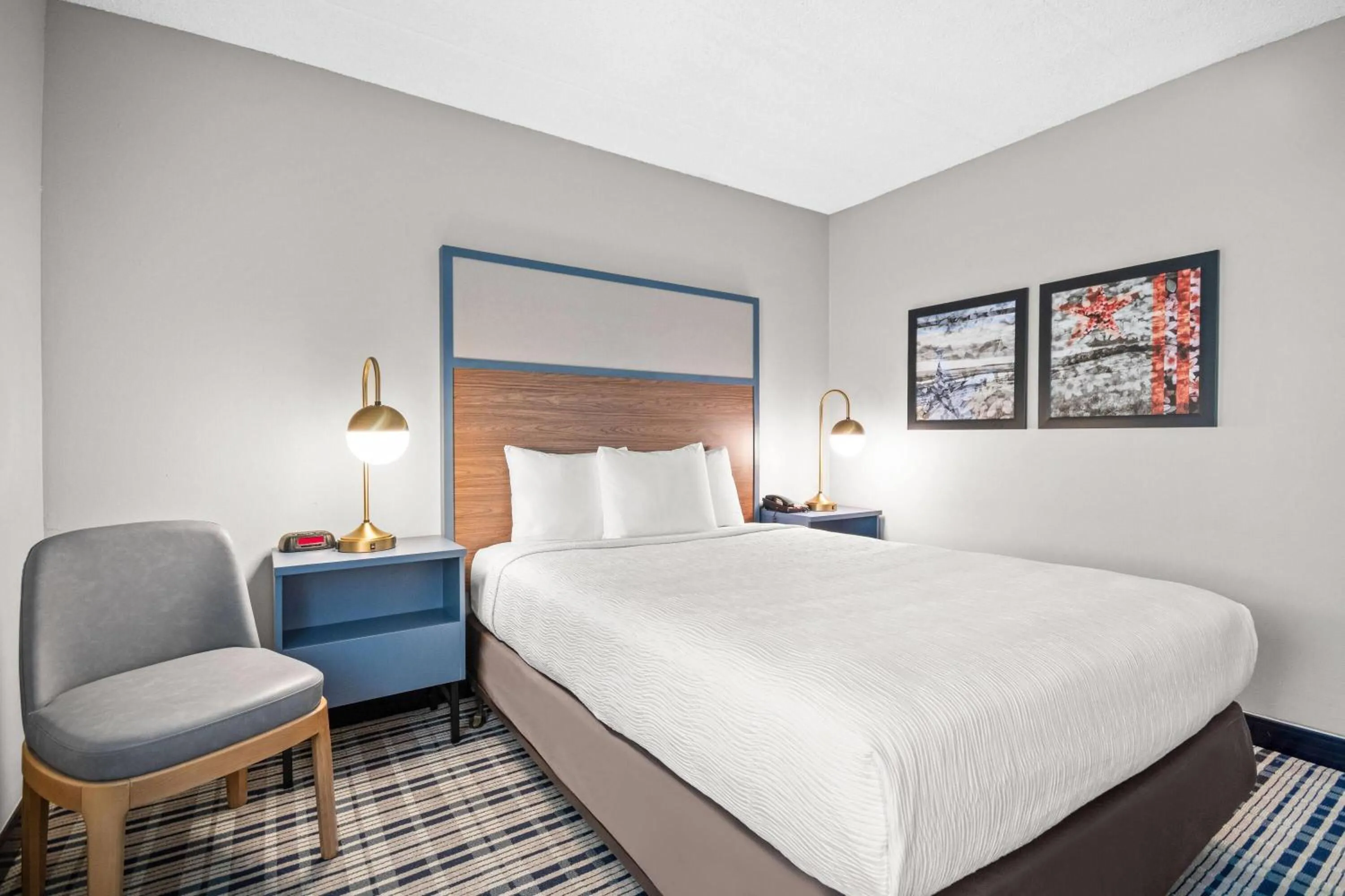 Bed in AmericInn by Wyndham Beloit