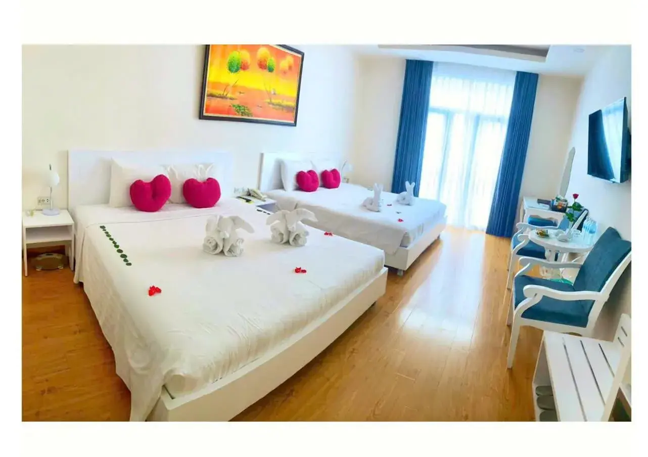 Deluxe Double Room with Two Double Beds in Hotel La Perle Deluxe Double Room with Two Double Beds in Hotel La Perle