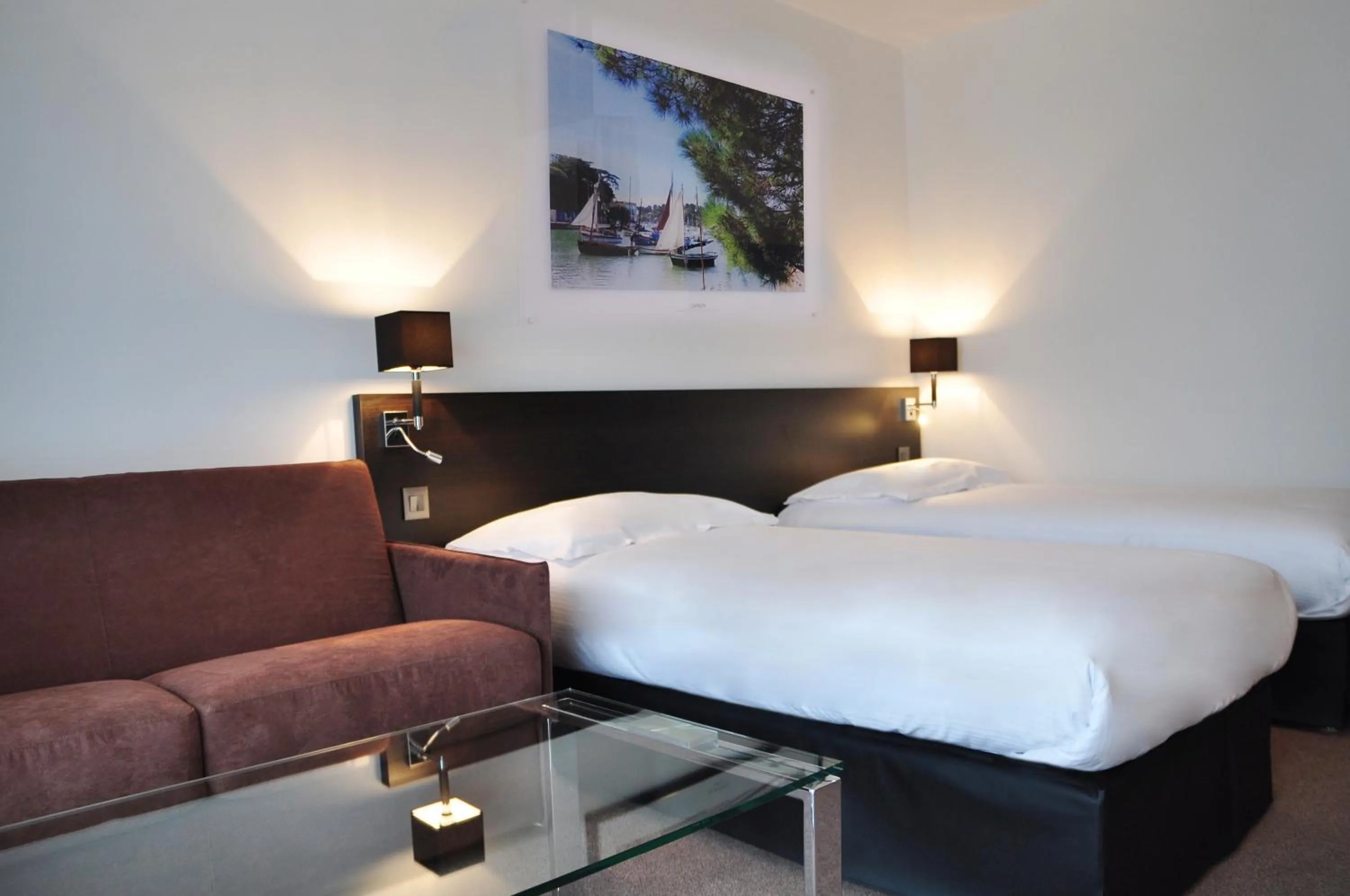 Photo of the whole room, Bed in Golden Tulip Pornic Suites- Appart Hotel