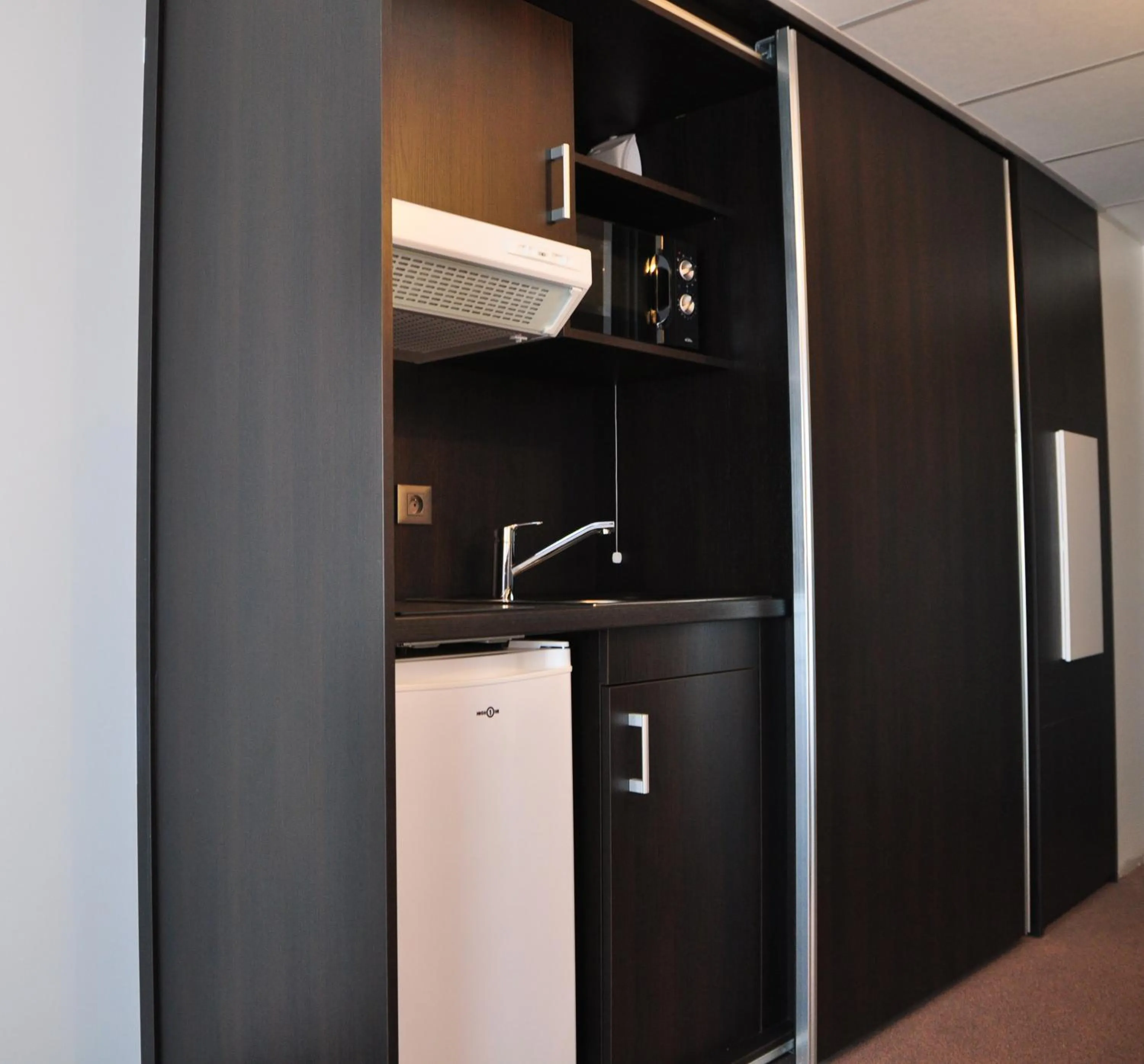 Photo of the whole room in Golden Tulip Pornic Suites- Appart Hotel