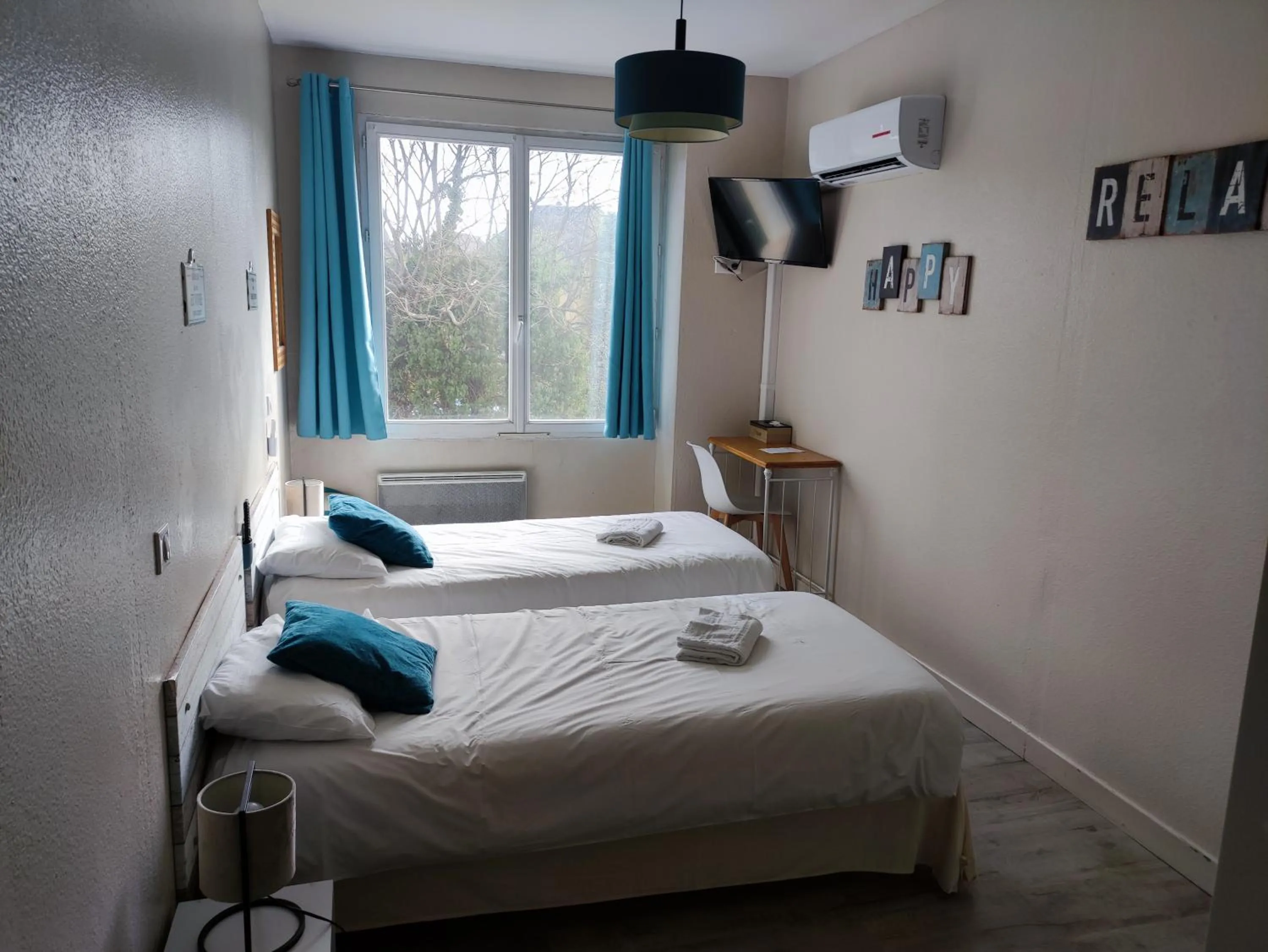 Bed in Hôtel Le P'tit Monde