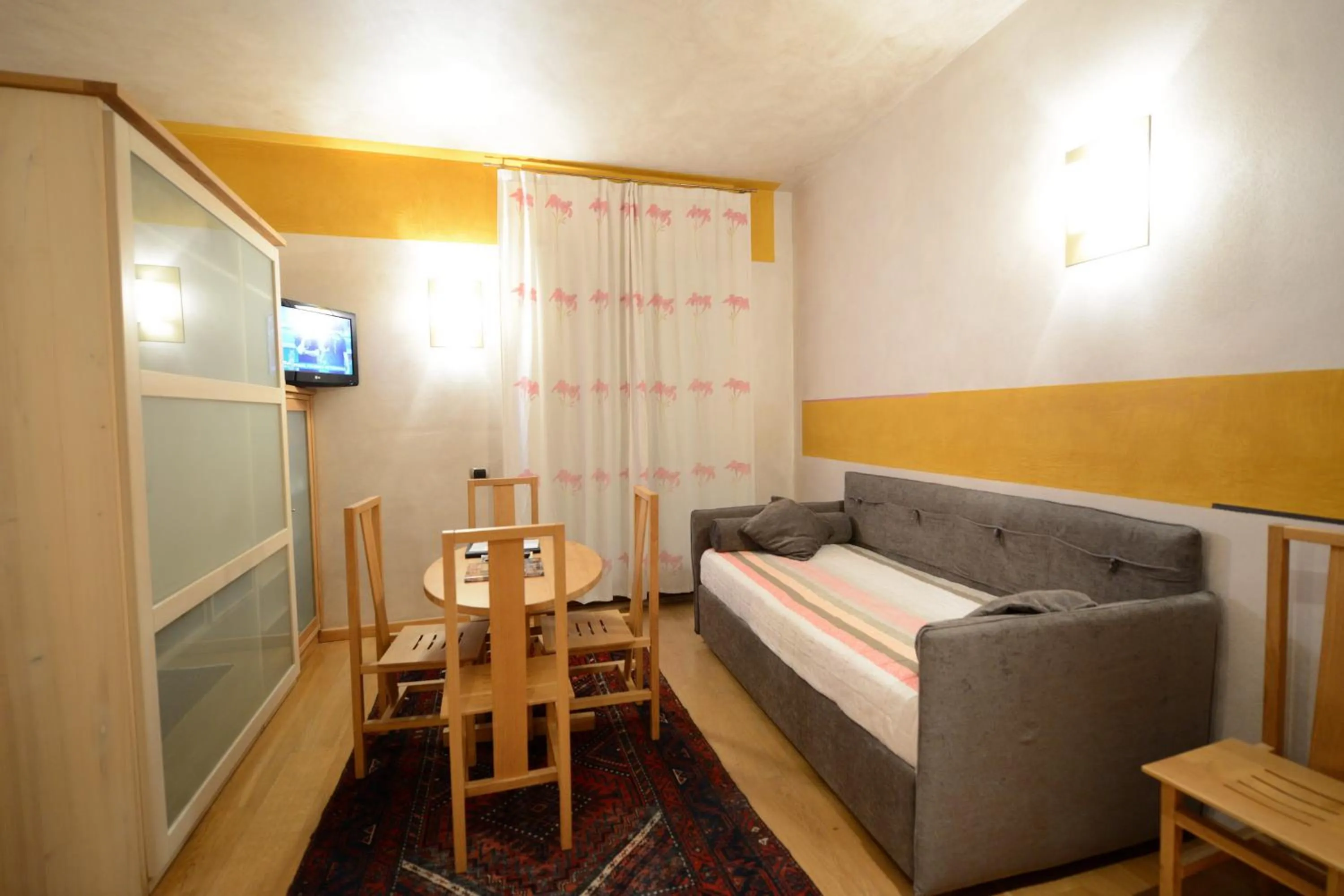 Living room, Bed in Appartamenti Porta Nuova 80