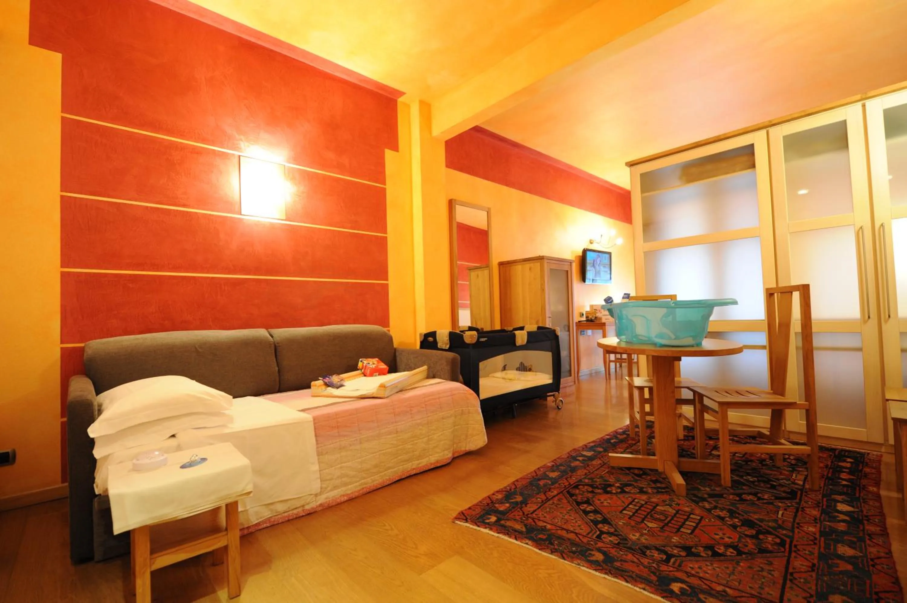 Seating area, Bed in Appartamenti Porta Nuova 80