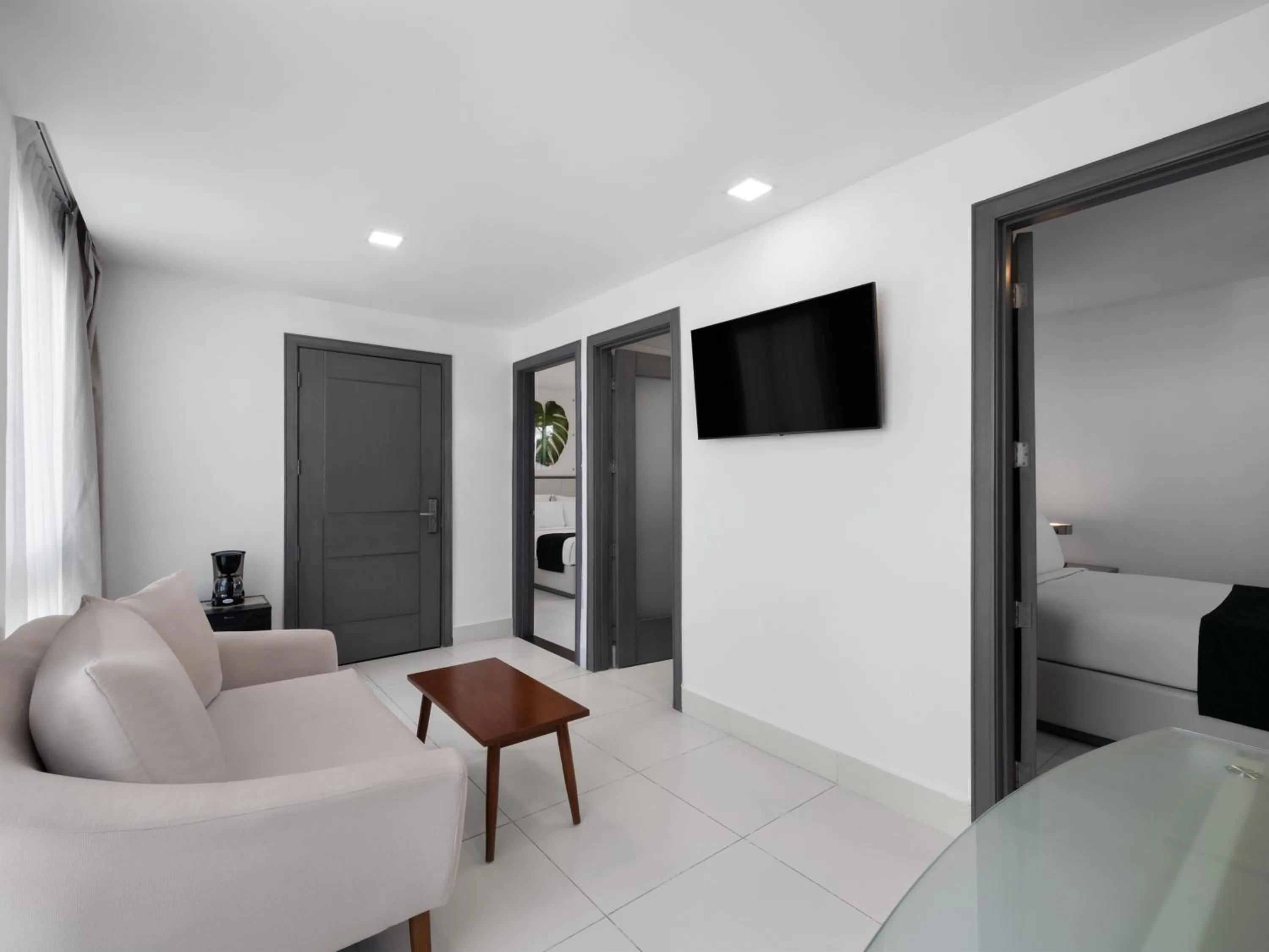 Communal lounge/ TV room in Gran Hotel Europa Santo Domingo Trademark Collection by Wyndham