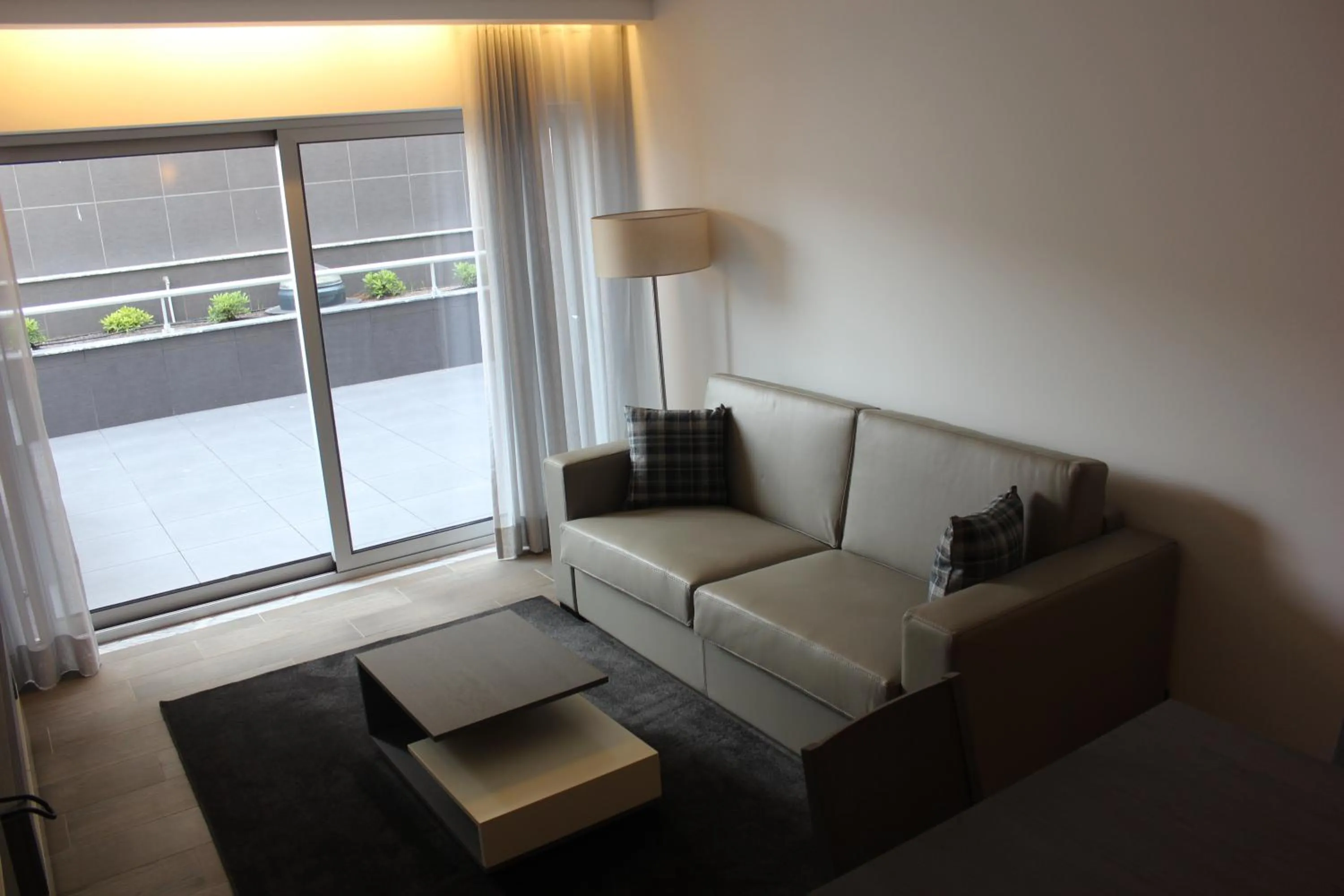 Communal lounge/ TV room in Apartamentos Turisticos da Nazare