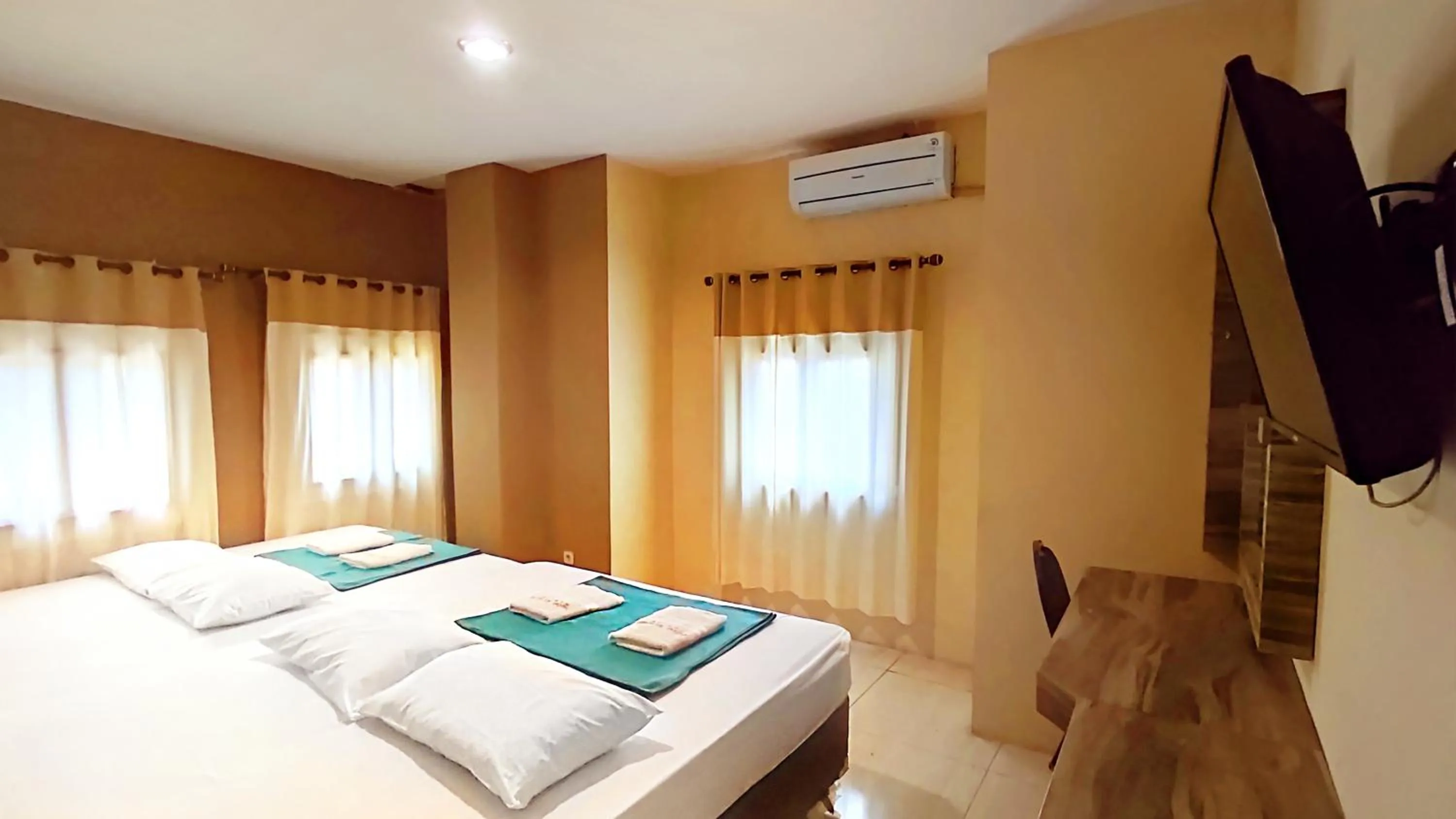 Bed in Hotel Syariah Larismanis