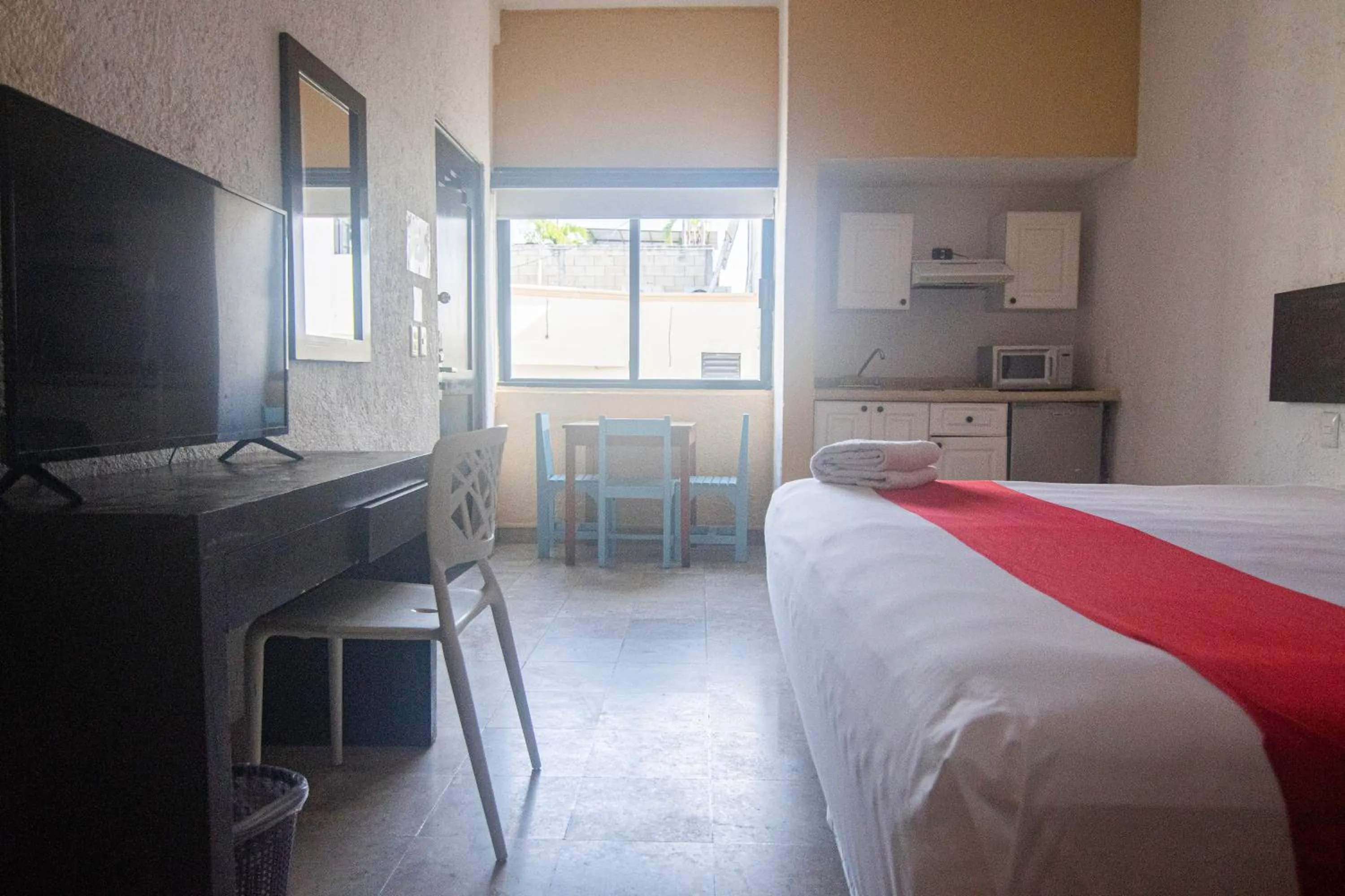 Kitchen or kitchenette, Bed in Hotel Maya Turquesa