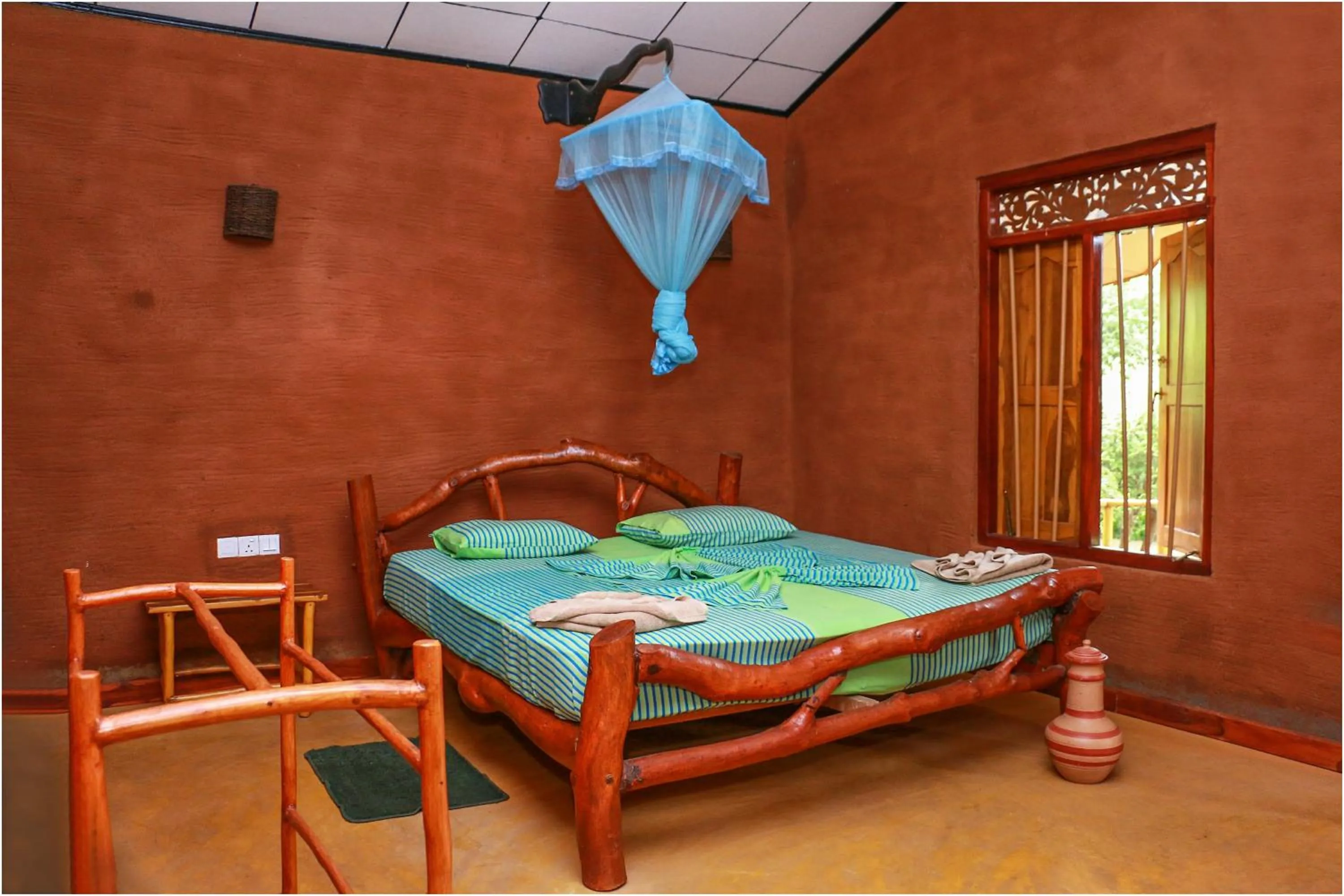 Bed in Yala Peace Cottages