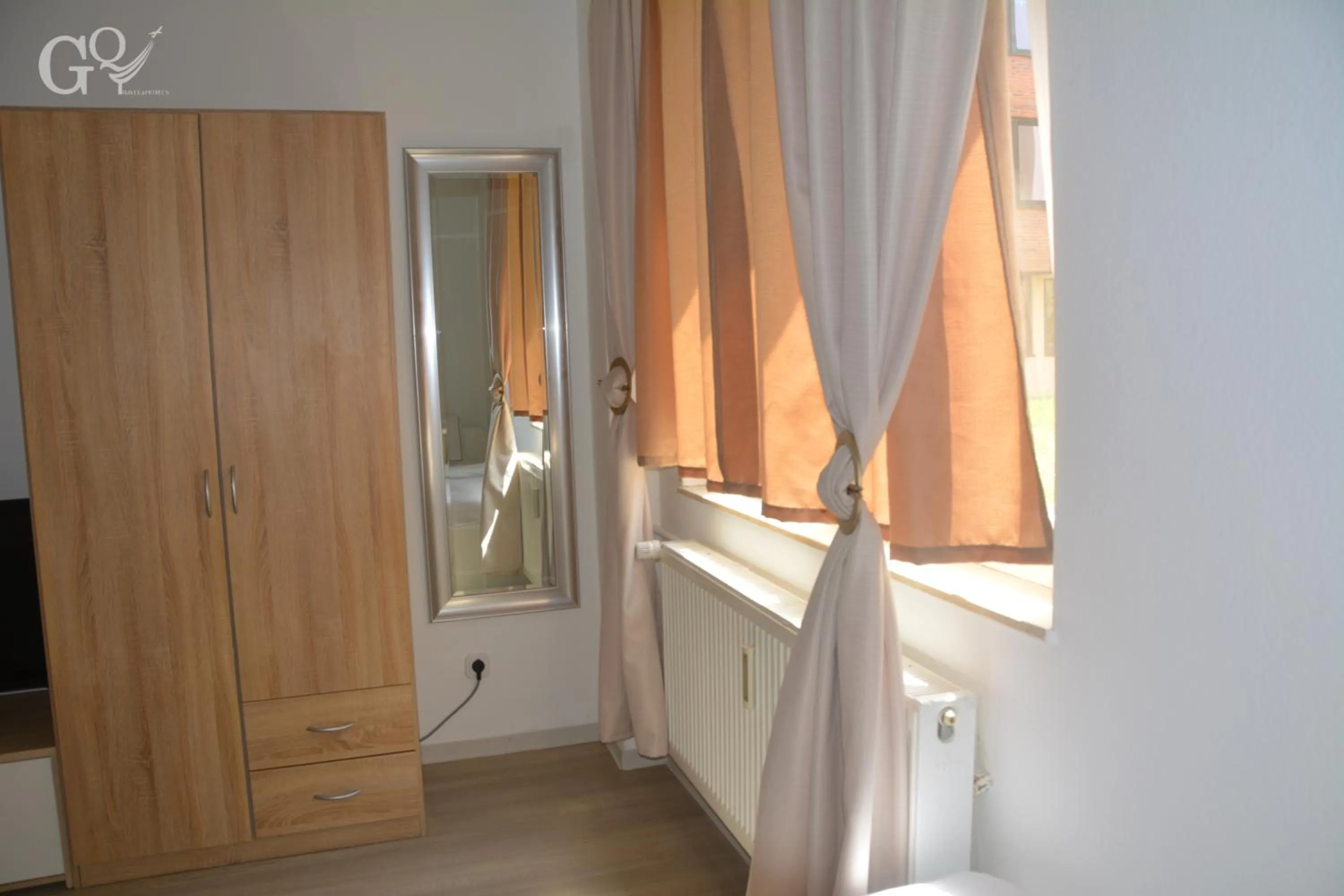 wardrobe, Bed in Saarbrücken City Apartments